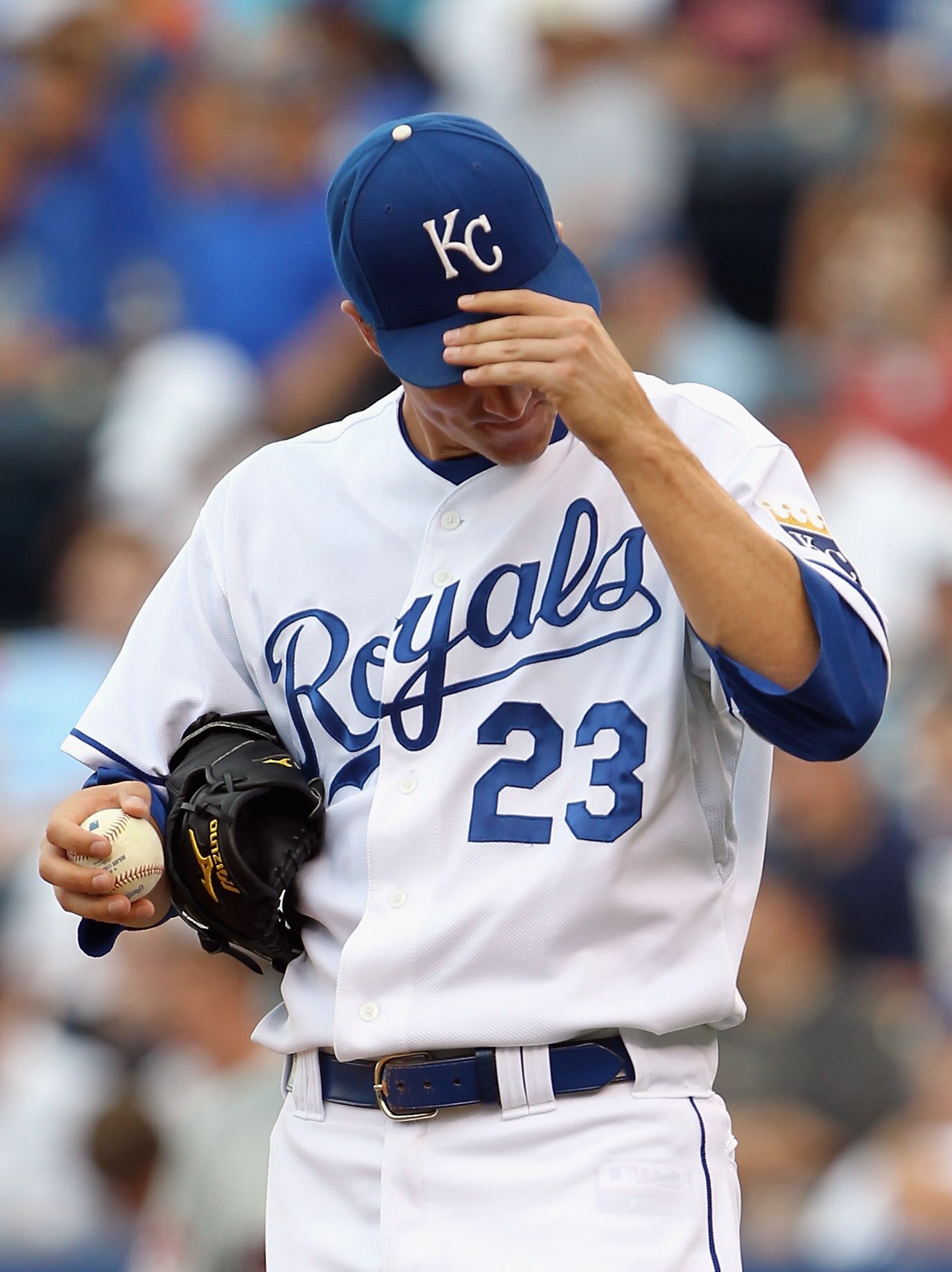 KANSAS CITY, MO - JULY 26:  Starting pitcher Zack Greinke #23 of the Kansas City Royals reacts after giving up a run during the game against the Minnesota Twins on July 26, 2010 at Kauffman Stadium in Kansas City, Missouri.  (Photo by Jamie Squire/Getty I