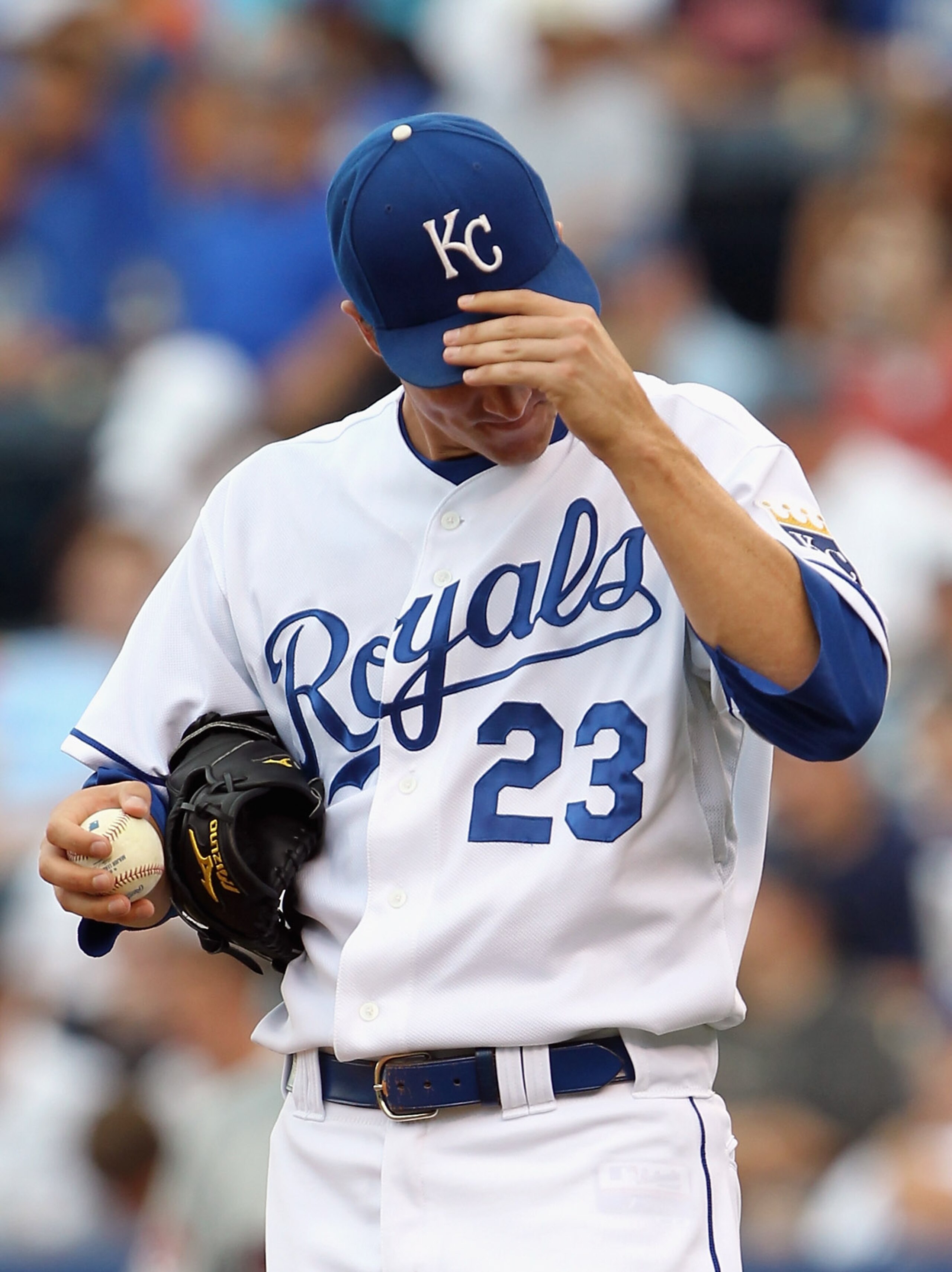 KANSAS CITY, MO - JULY 26:  Starting pitcher Zack Greinke #23 of the Kansas City Royals reacts after giving up a run during the game against the Minnesota Twins on July 26, 2010 at Kauffman Stadium in Kansas City, Missouri.  (Photo by Jamie Squire/Getty I