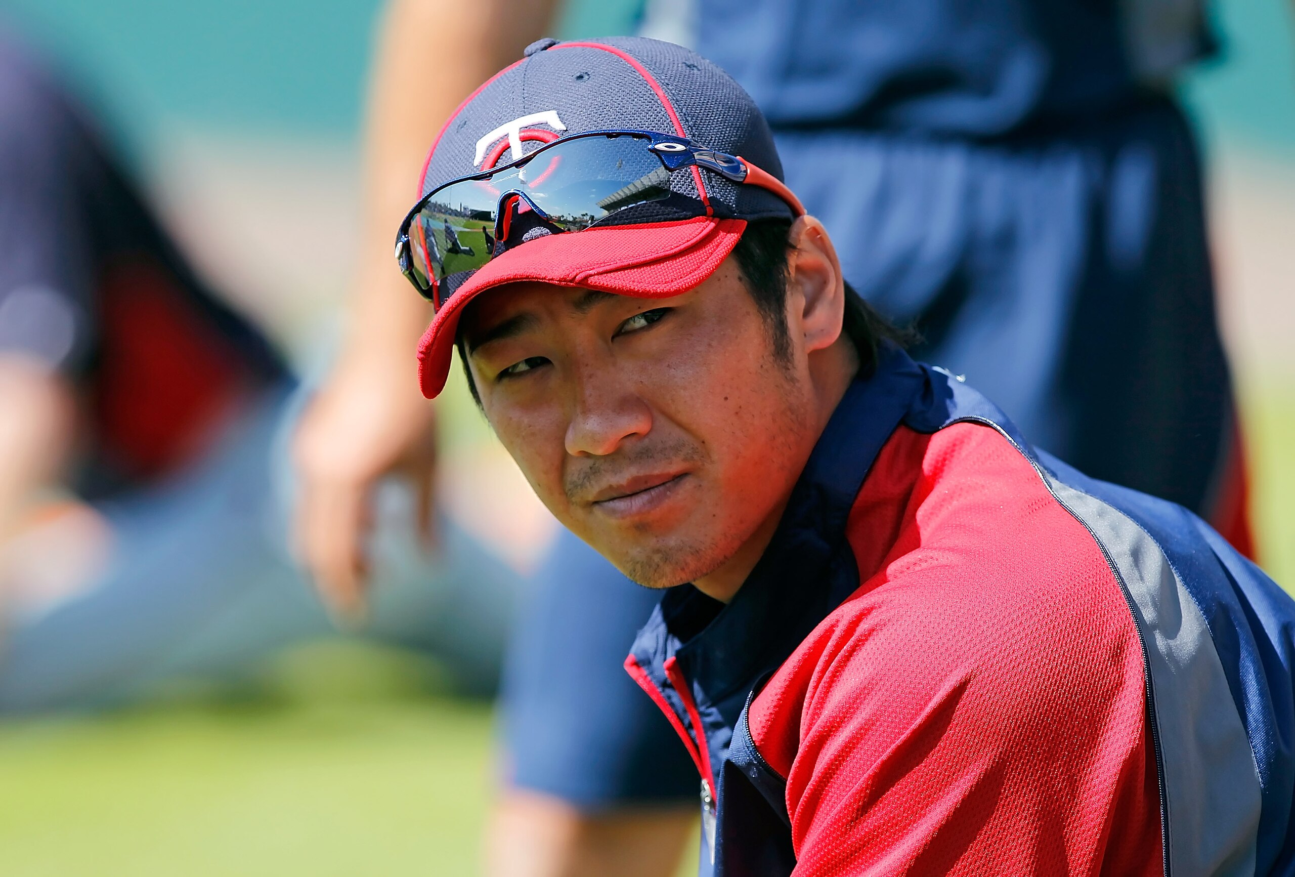 SARASOTA, FL - MARCH 03:  Infielder Tsuyoshi Nishioka #1 of the Minnesota Twins stretches just before the Grapefruit League Spring Training Game against the Baltimore Orioles at Ed Smith Stadium on March 3, 2011 in Sarasota, Florida.  (Photo by J. Meric/G