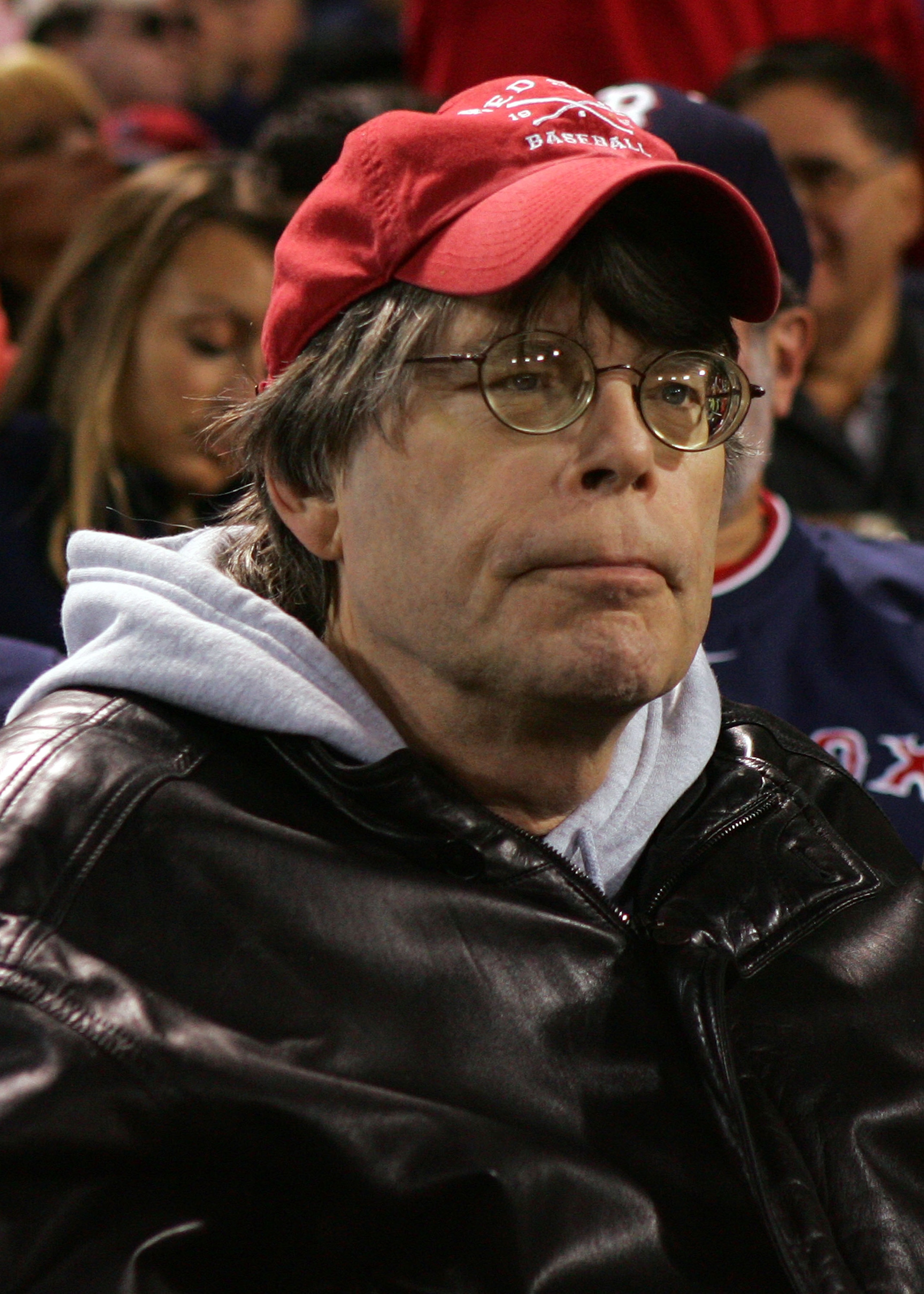 BOSTON - OCTOBER 13:  Author Stephen King watches as the Tampa Bay Rays play against the Boston Red Sox during game three of the American League Championship Series against during the 2008 MLB playoffs at Fenway Park on October 13, 2008 in Boston, Massach
