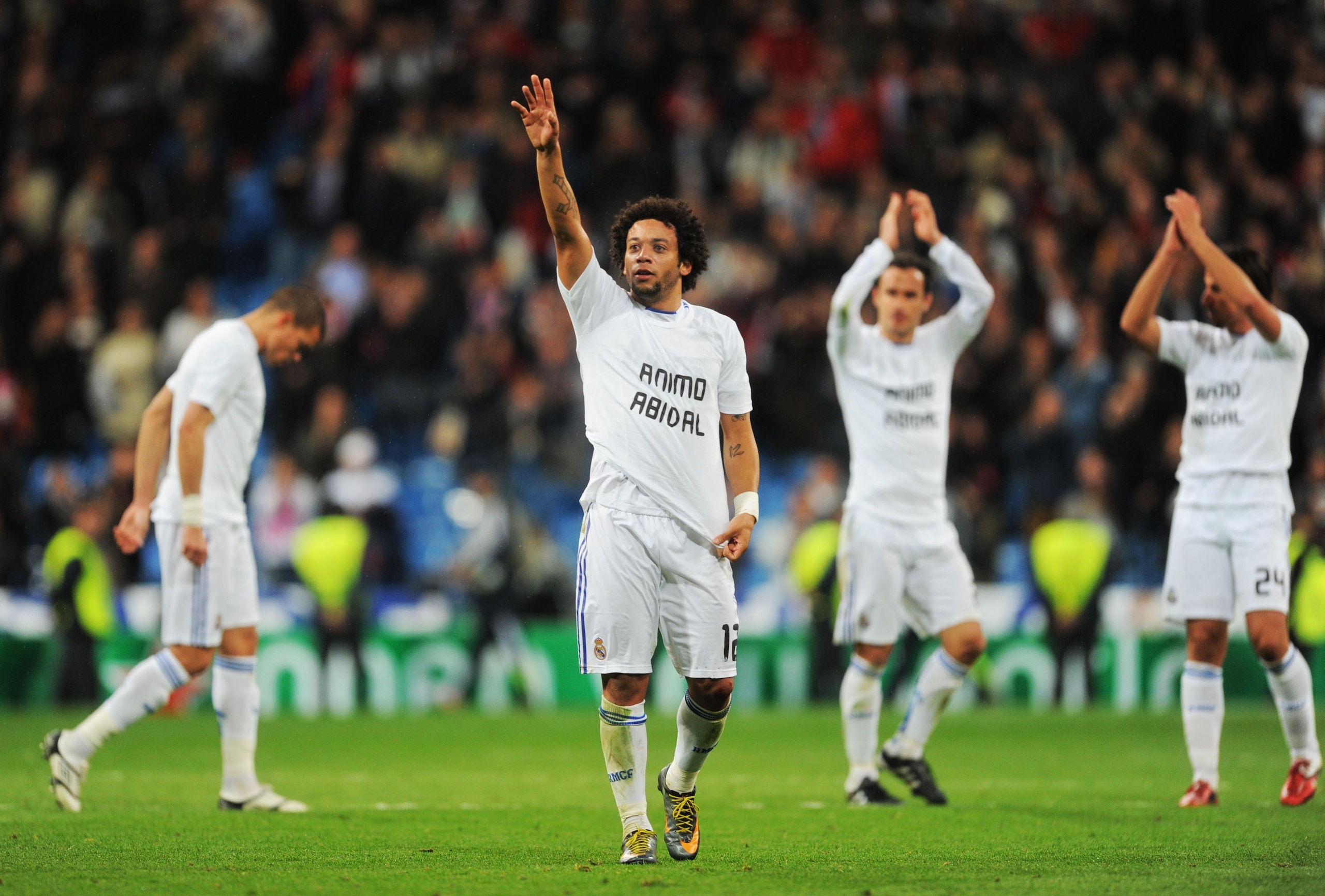 MADRID, SPAIN - MARCH 16: Marcelo (C) of Real Madrid salutes fans at the end of the UEFA Champions League round of 16 second leg match between Real Madrid and Lyon at Estadio Santiago Bernabeu on March 16, 2011 in Madrid, Spain.  (Photo by Denis Doyle/Get