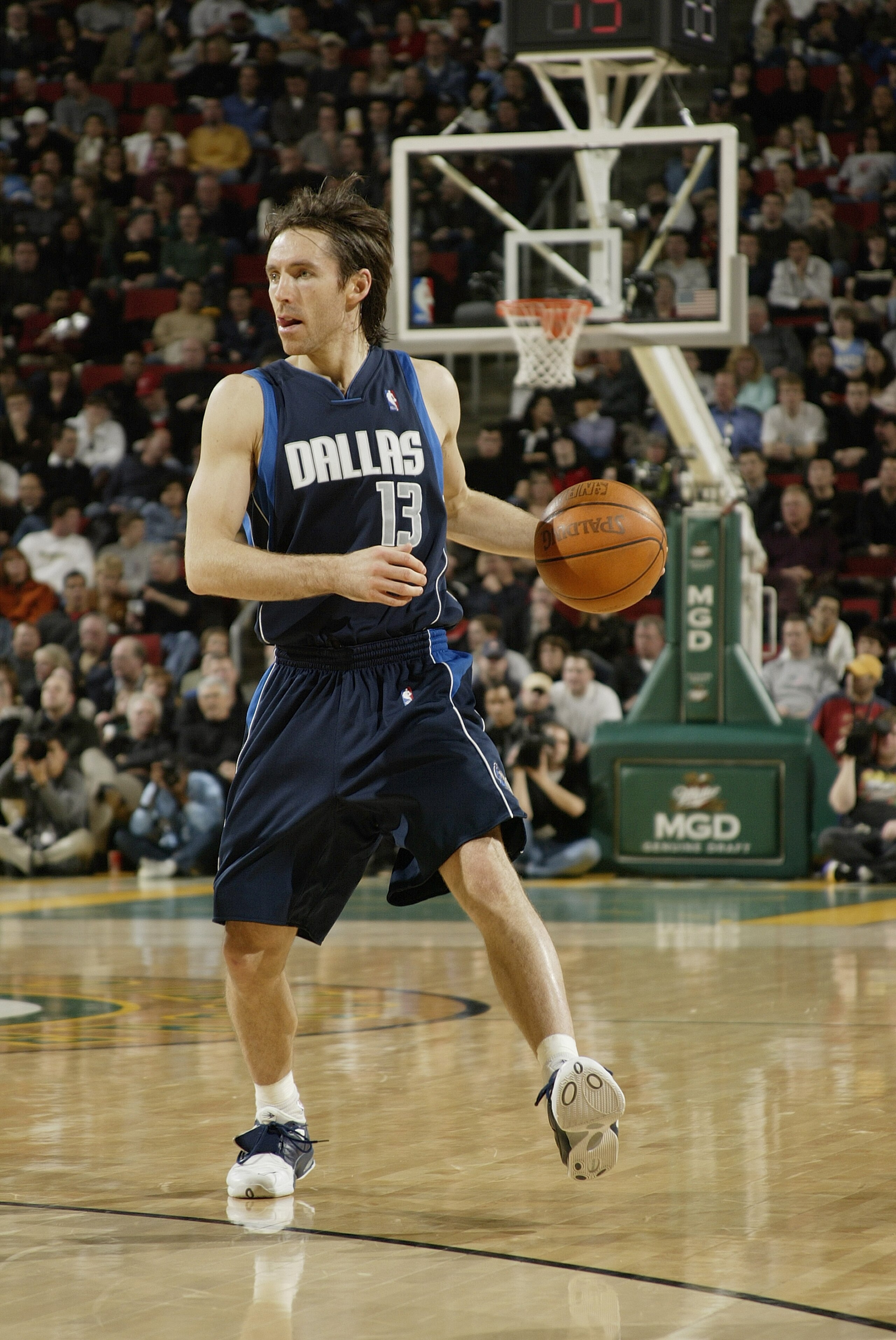 SEATTLE - JANUARY 27:  Steve Nash #13 of the Dallas Mavericks moves the ball during the game against the Seattle Sonics on January 27, 2004 at Key Arena in Seattle, Washington.  The Mavericks won 118-116.  NOTE TO USER: User expressly acknowledges and agr