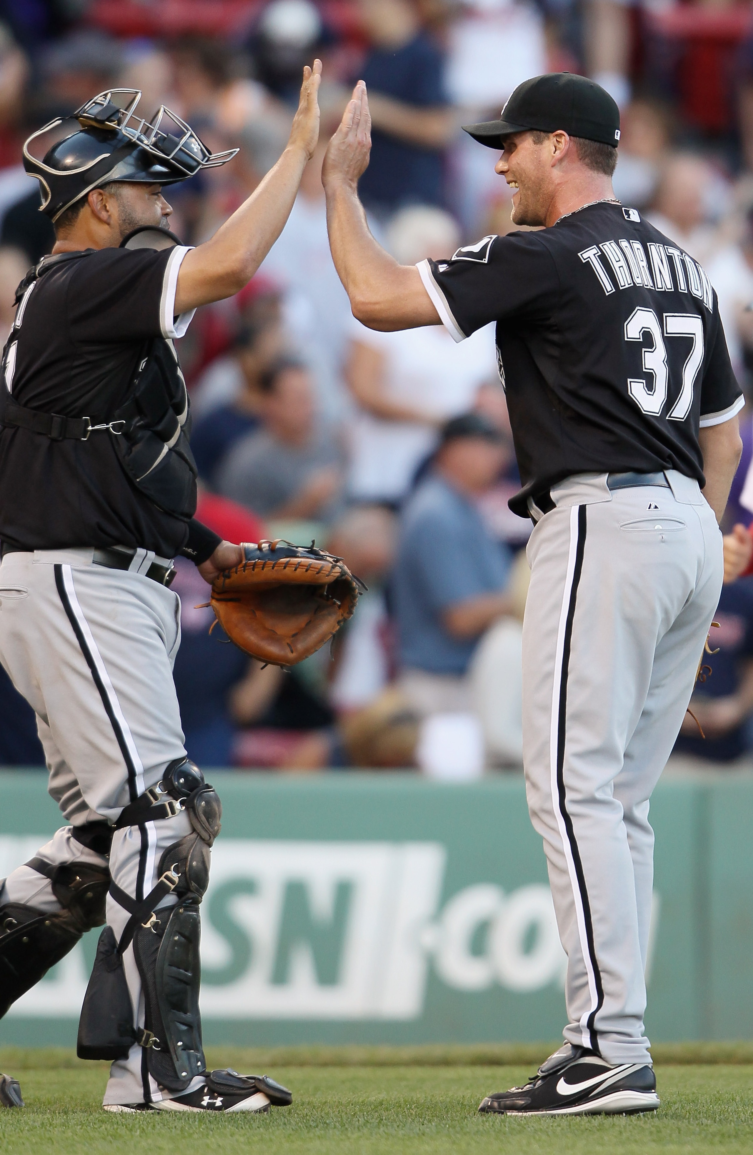 BOSTON - SEPTEMBER 05:  Matt Thornton #37 of the Chicago White Sox celebrates the win with Ramon Castro #27 on September 5, 2010 at Fenway Park in Boston, Massachusetts.The White Sox defeated the Boston Red Sox 7-5.  (Photo by Elsa/Getty Images)