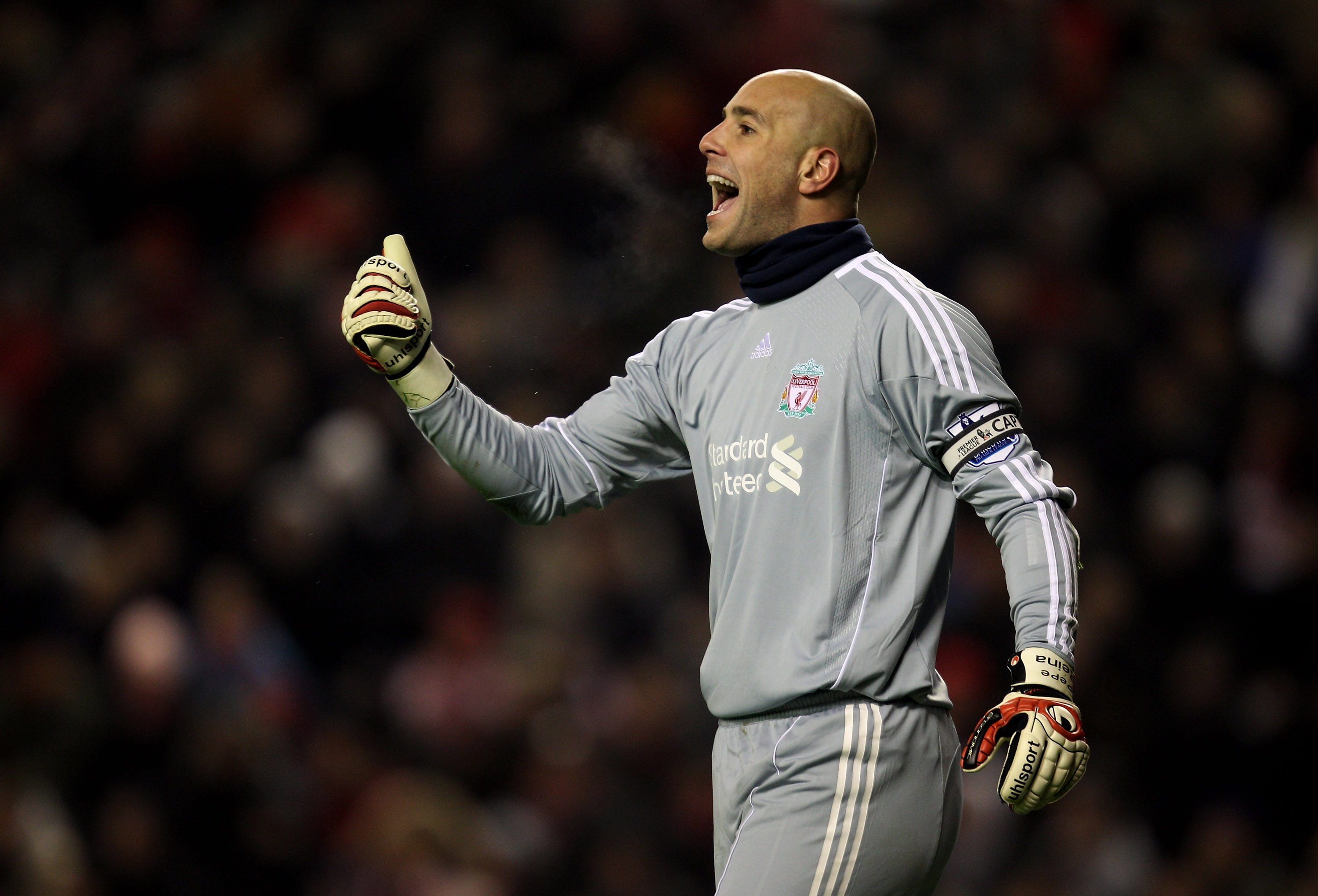 LIVERPOOL, ENGLAND - DECEMBER 06:   Pepe Reina of Liverpool shouts to his team mates during the Barclays Premier League match between Liverpool and Aston Villa at Anfield on December 6, 2010 in Liverpool, England. (Photo by Mark Thompson/Getty Images)