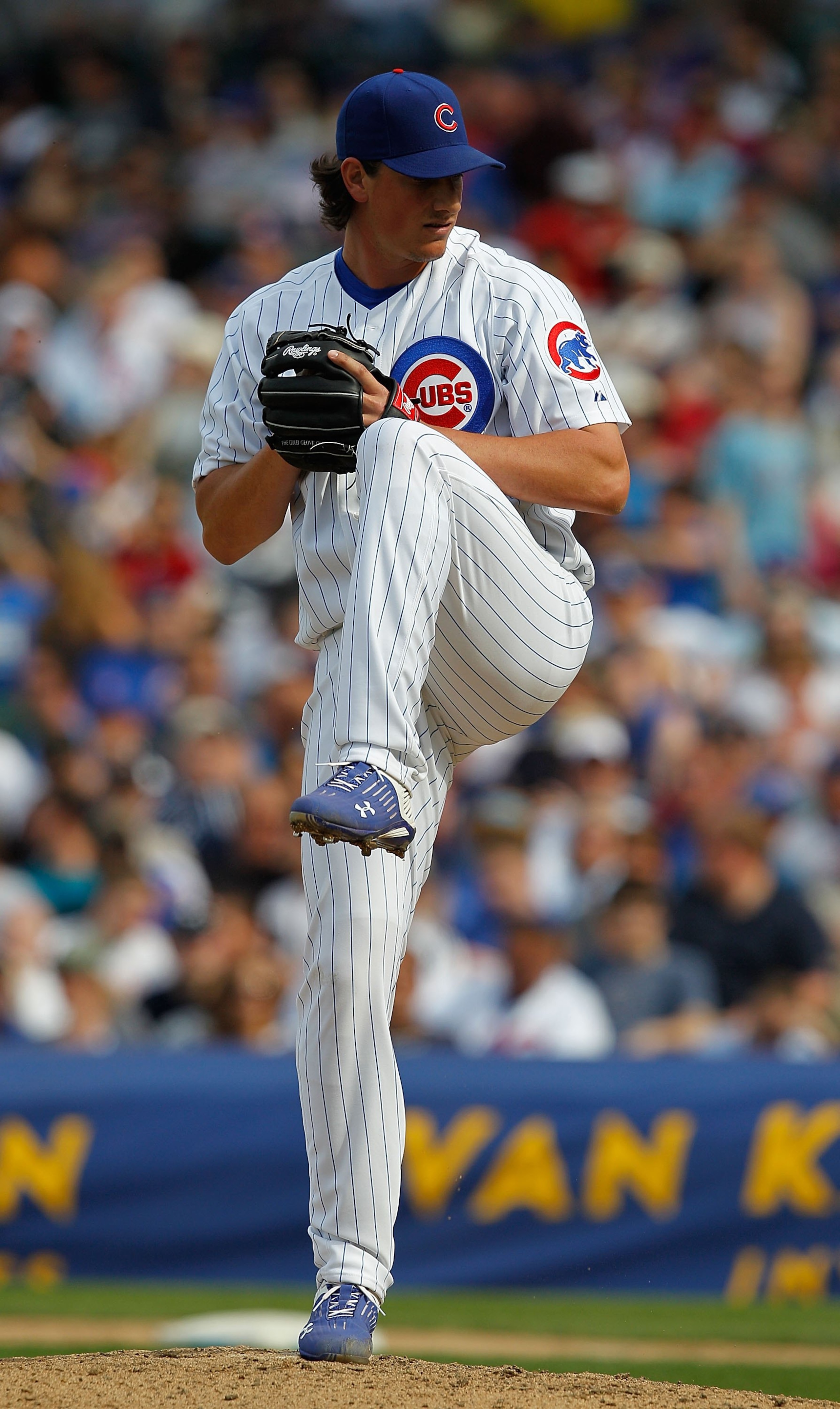 CHICAGO - APRIL 15: Jeff Samardzija of the Chicago Cubs, wearing a number 42 jersey in honor of Jackie Robinson,  prepares to throw the ball against the Milwaukee Brewers at Wrigley Field on April 15, 2010 in Chicago, Illinois. The Brewers defeated the Cu