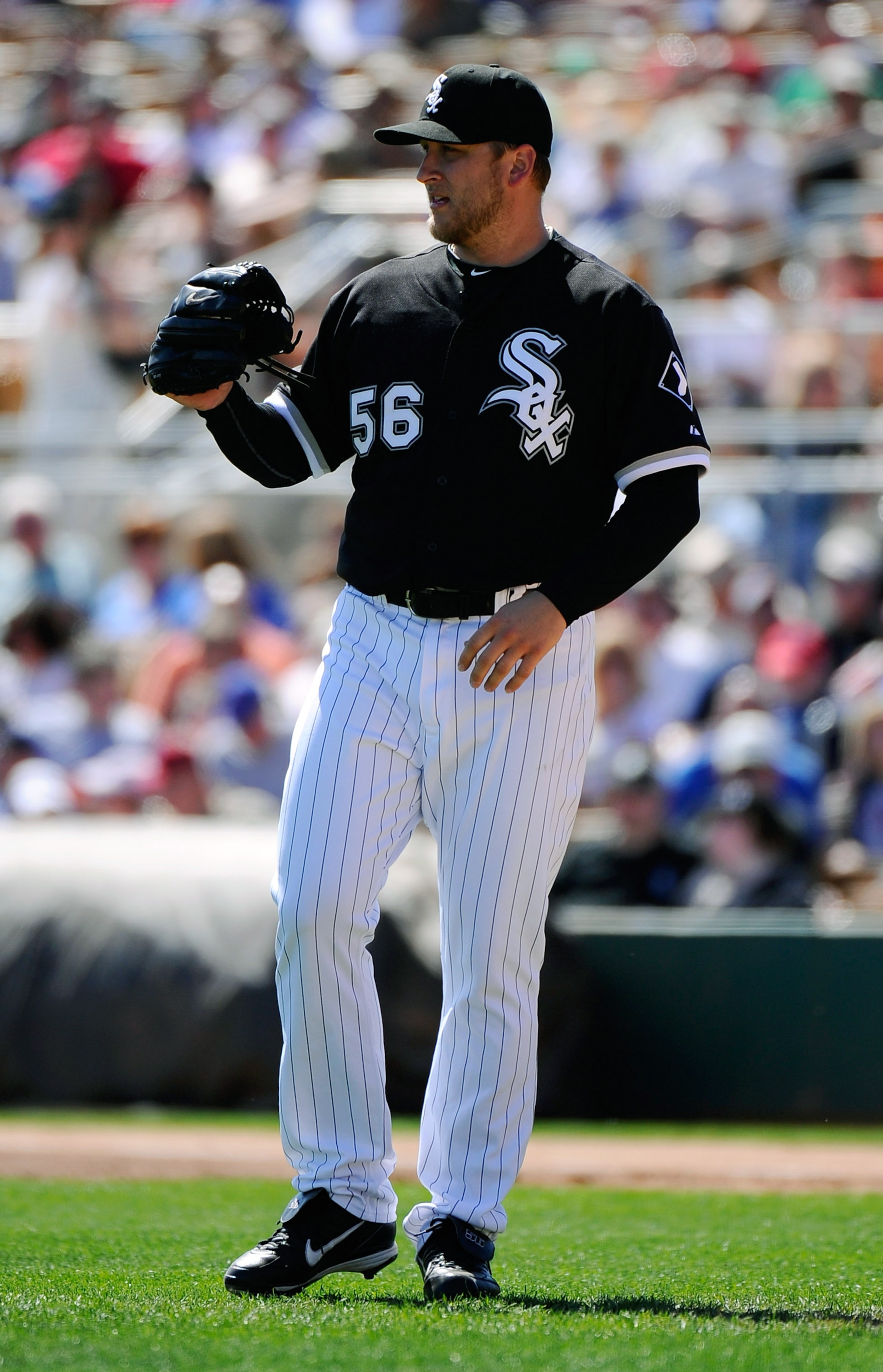 GLENDALE, AZ - MARCH 11:  Pitcher Mark Buehrle #56 of the Chicago White Sox reacts after giving up a home run to Geovany Soto #18 of the Chicago Cubs during the spring training baseball game at Camelback Ranch on March 11, 2011 in Glendale, Arizona.  (Pho