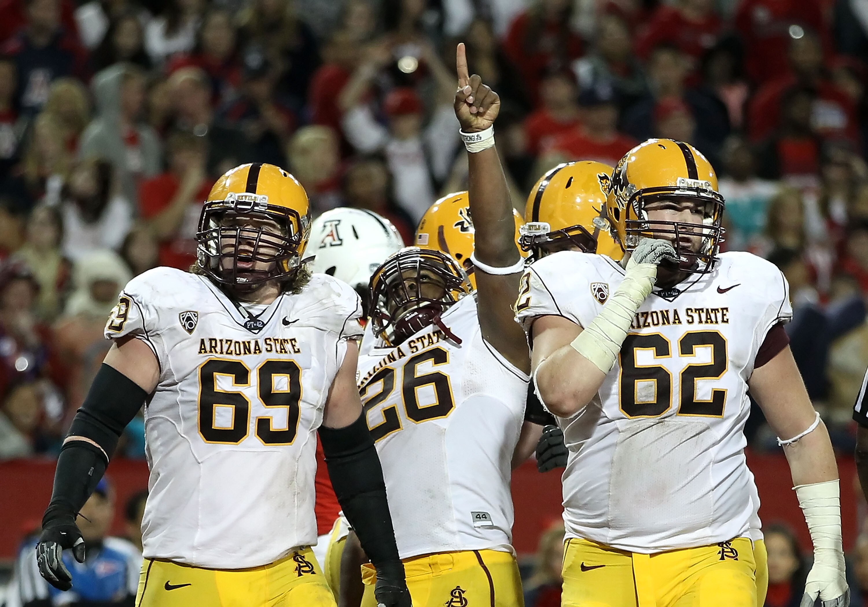 TUCSON, AZ - DECEMBER 02:  Runningback Cameron Marshall #26 of the Arizona State Sun Devils celebrates after scoring a 2 yard rushing touchdown against the Arizona Wildcats during the double overtime of the college football game at Arizona Stadium on Dece