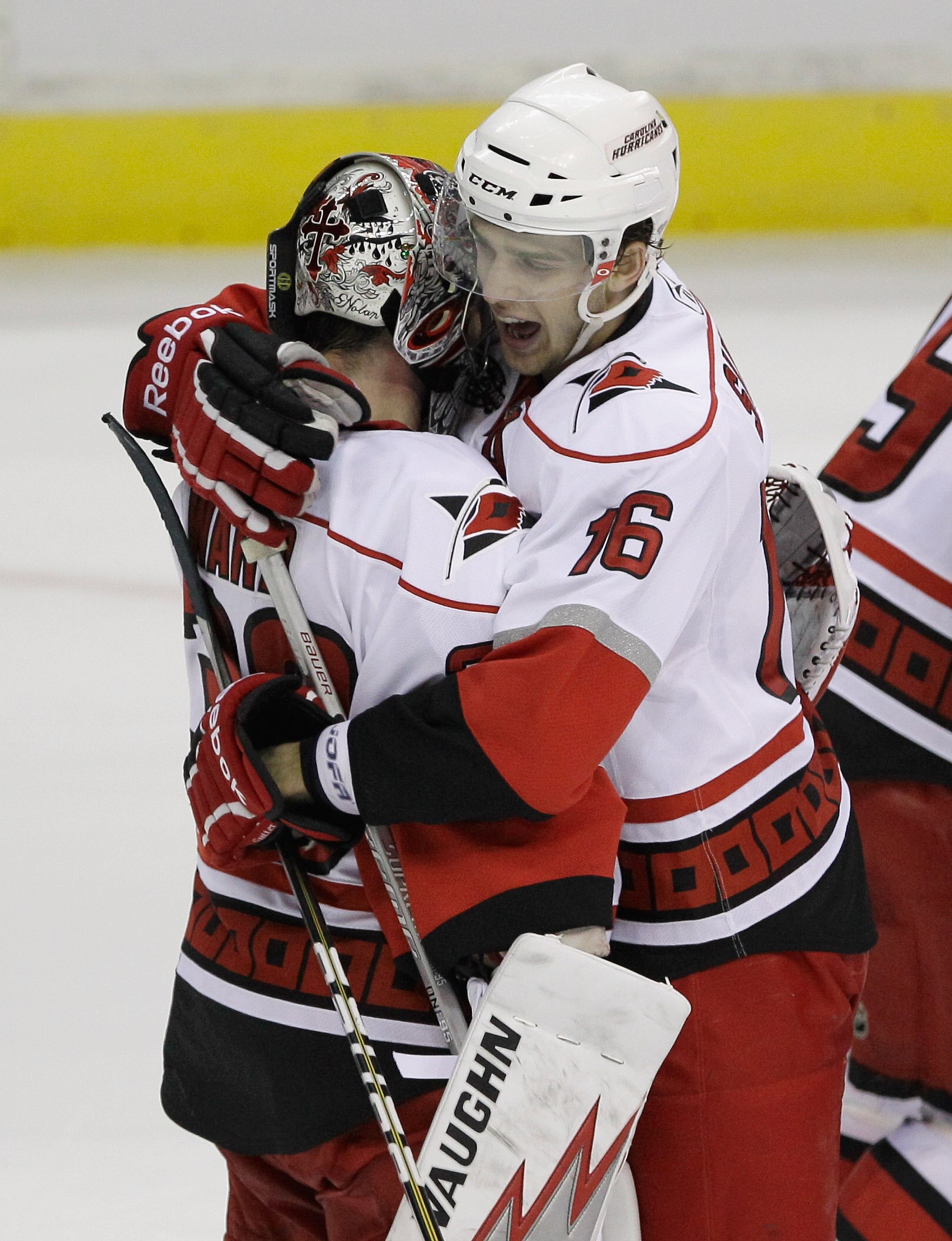 WASHINGTON, DC - MARCH 29:  Goalie Cam Ward #30 and teammate Brandon Sutter (16) of the Carolina Hurricanes celebrate their 3-2 win in a shootout against the Washington Capitals at the Verizon Center on March 29, 2011 in Washington, DC.  (Photo by Rob Car