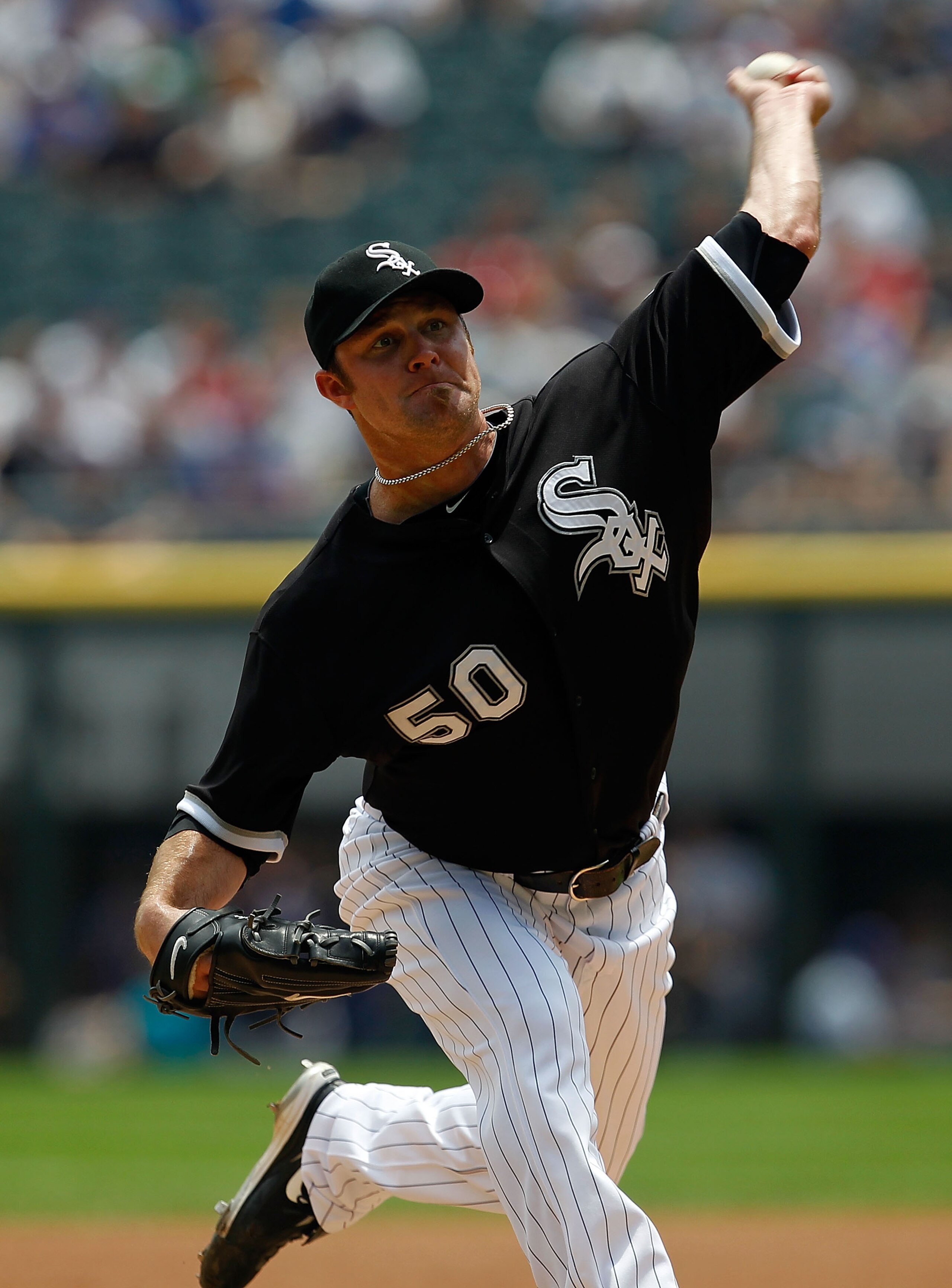 CHICAGO - JUNE 27: Starting pitcher John Danks #50 of the Chicago White Sox delivers the ball against the Chicago Cubs at U.S. Cellular Field on June 27, 2010 in Chicago, Illinois. (Photo by Jonathan Daniel/Getty Images)