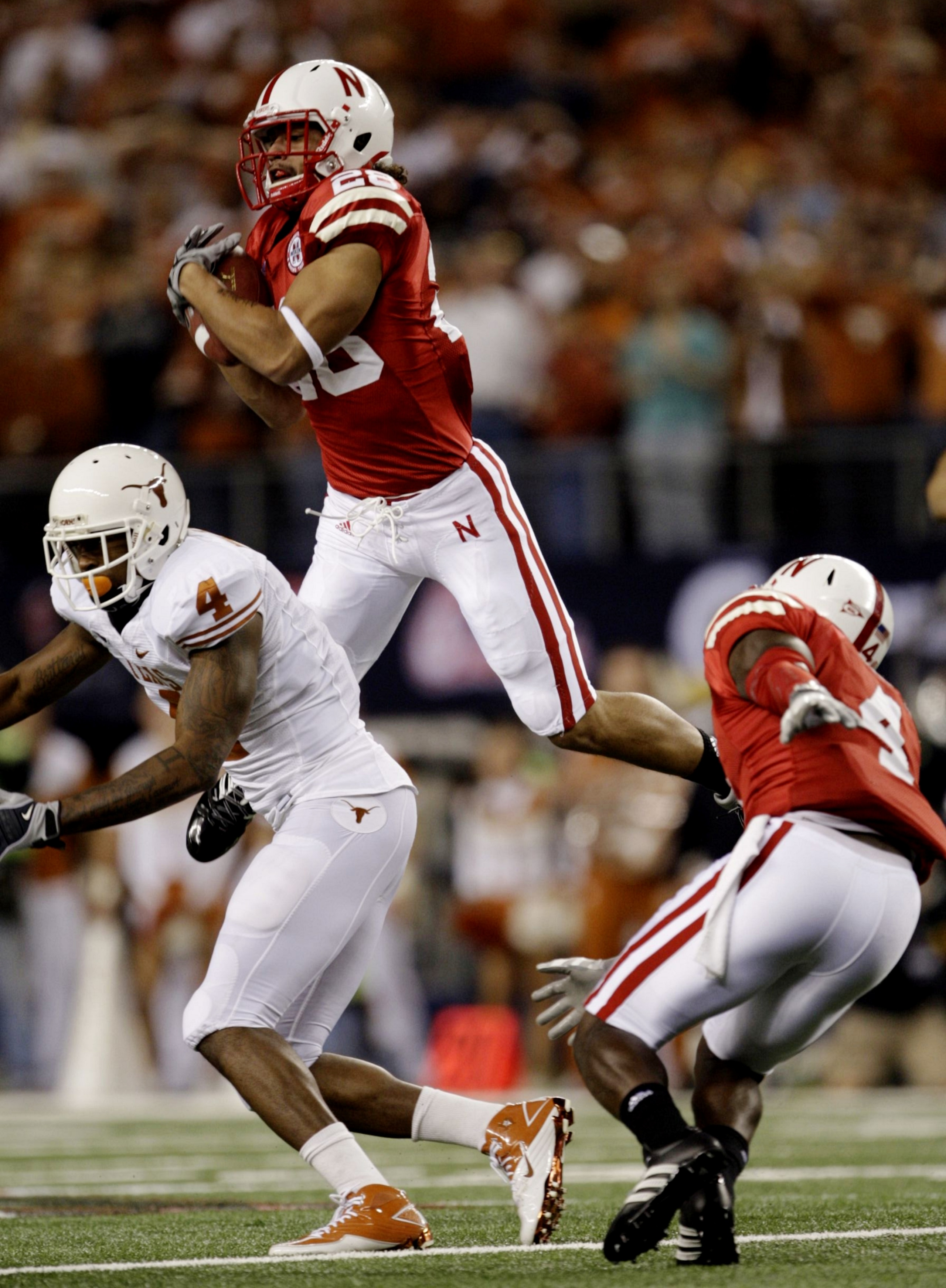 ARLINGTON, TX - DECEMBER 5:  Eric Hagg #28 of the Nebraska Cornhuskers catches the ball for an interception in the first quarter against the Texas Longhorns at Cowboys Stadium on December 5, 2009 in Arlington, Texas.  (Photo by Jamie Squire/Getty Images)