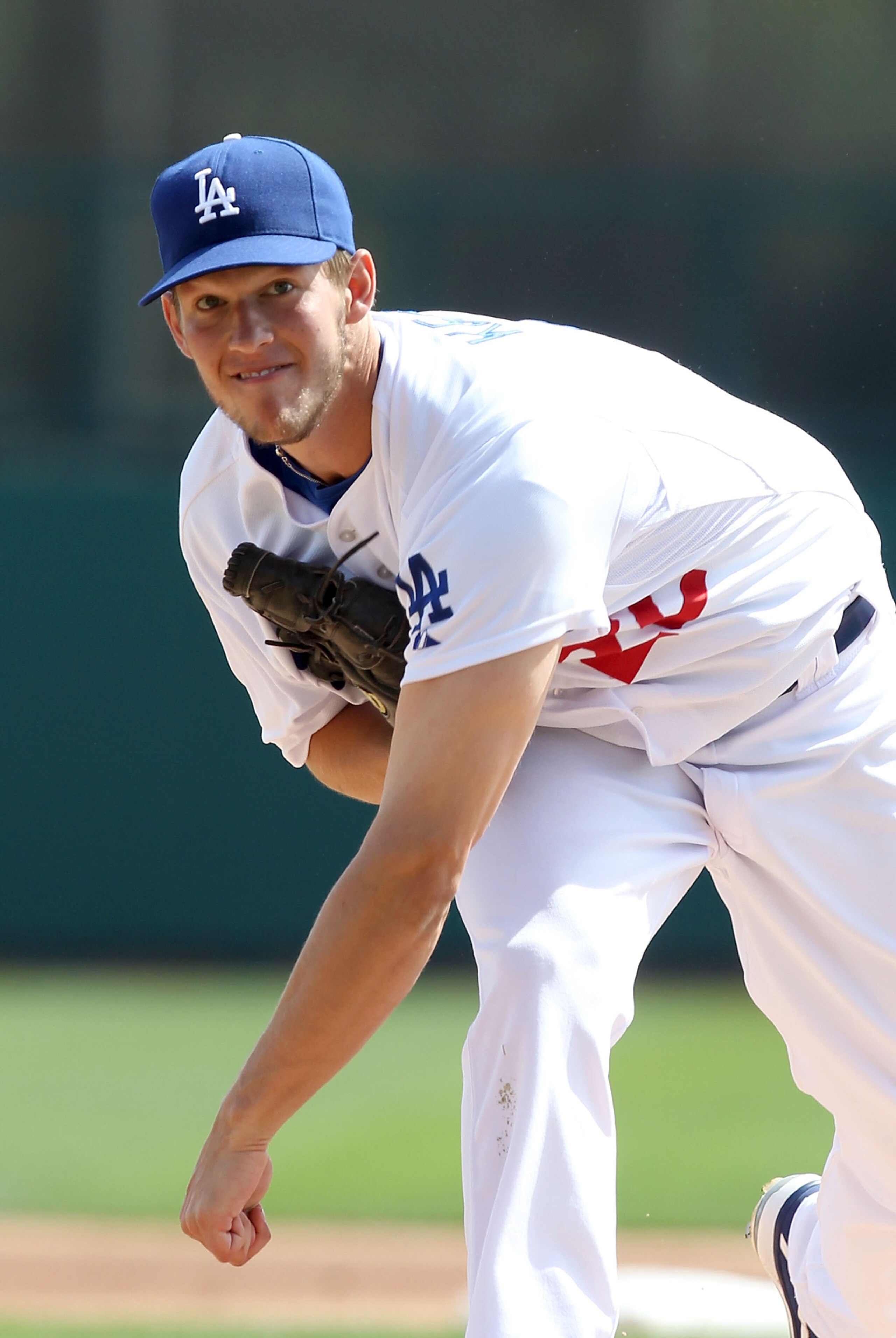 GLENDALE, AZ - MARCH 05:  Starting pitcher Clayton Kershaw #22 of the Los Angeles Dodgers pitches against the Cincinnati Reds during the spring training game at Camelback Ranch on March 5, 2011 in Glendale, Arizona.  (Photo by Christian Petersen/Getty Ima