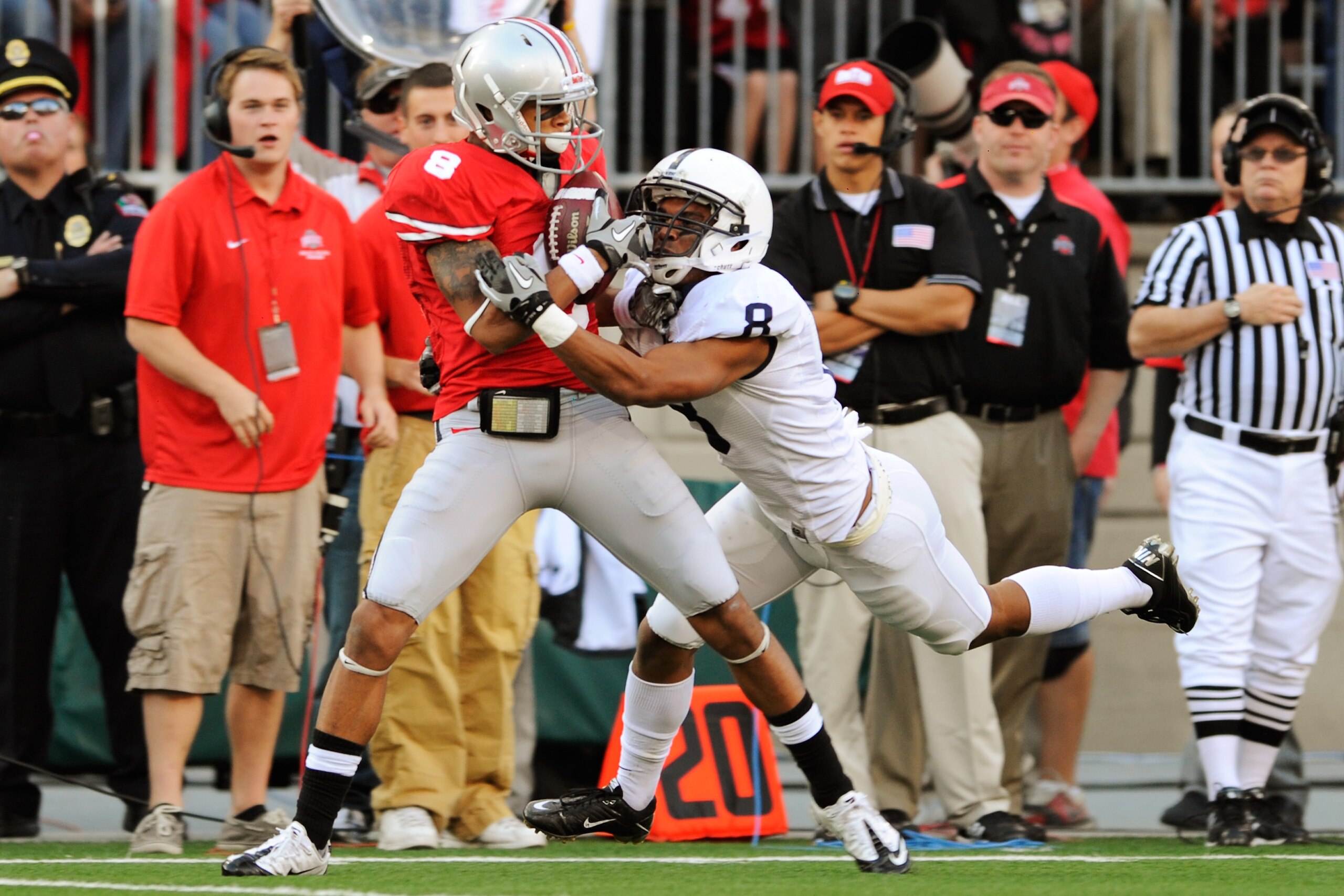 COLUMBUS, OH - NOVEMBER 13:  DeVier Posey #8 of the Ohio State Buckeyes pulls in a 49-yard pass reception as D'Anton Lynn #8 of the Penn State Nittany Lions defends at Ohio Stadium on November 13, 2010 in Columbus, Ohio.  (Photo by Jamie Sabau/Getty Image