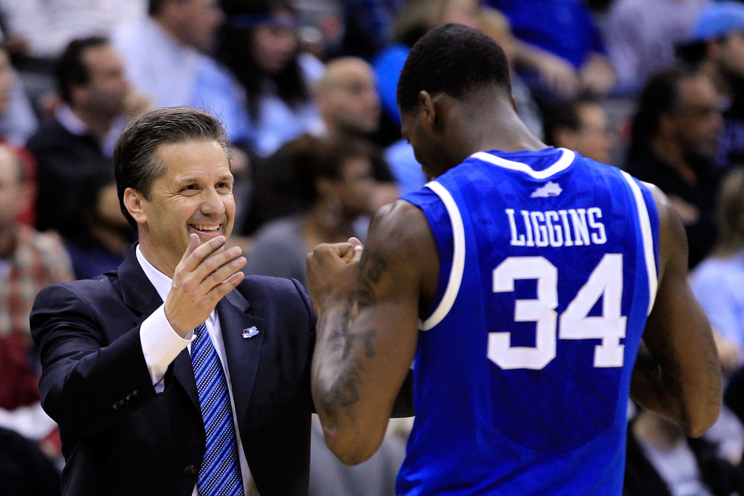 NEWARK, NJ - MARCH 27:  Head coach John Calipari (L) hugs DeAndre Liggins (R) #34 of the Kentucky Wildcats after defeating the North Carolina Tar Heels in the east regional final of the 2011 NCAA men's basketball tournament at Prudential Center on March 2