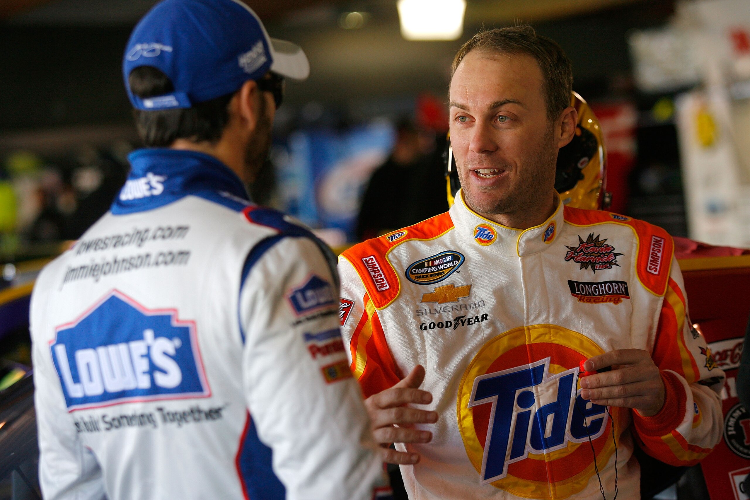 MARTINSVILLE, VA - MARCH 27:  Kevin Harvick, driver of the #29 Shell/Pennzoil Chevrolet speaks with Jimmie Johnson, driver of the #48 Lowe's Chevrolet in the garage area during practice for the NASCAR Sprint Cup Series Goody's Fast Pain Relief 500 at Mart