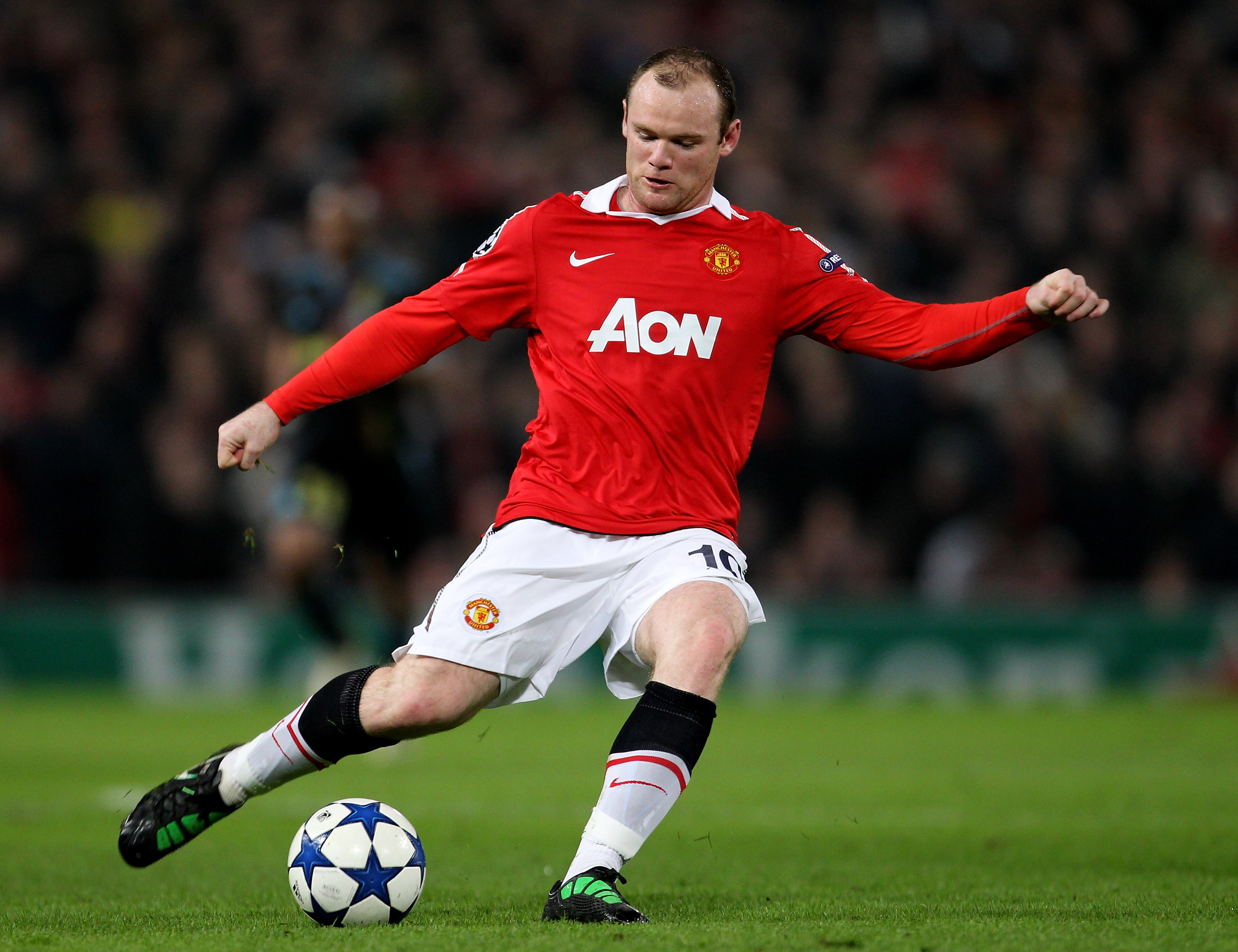 MANCHESTER, ENGLAND - MARCH 15:  Wayne Rooney of Manchester United in action during the UEFA Champions League round of 16 second leg match between Manchester United and Marseille at Old Trafford on March 15, 2011 in Manchester, England.  (Photo by Alex Li