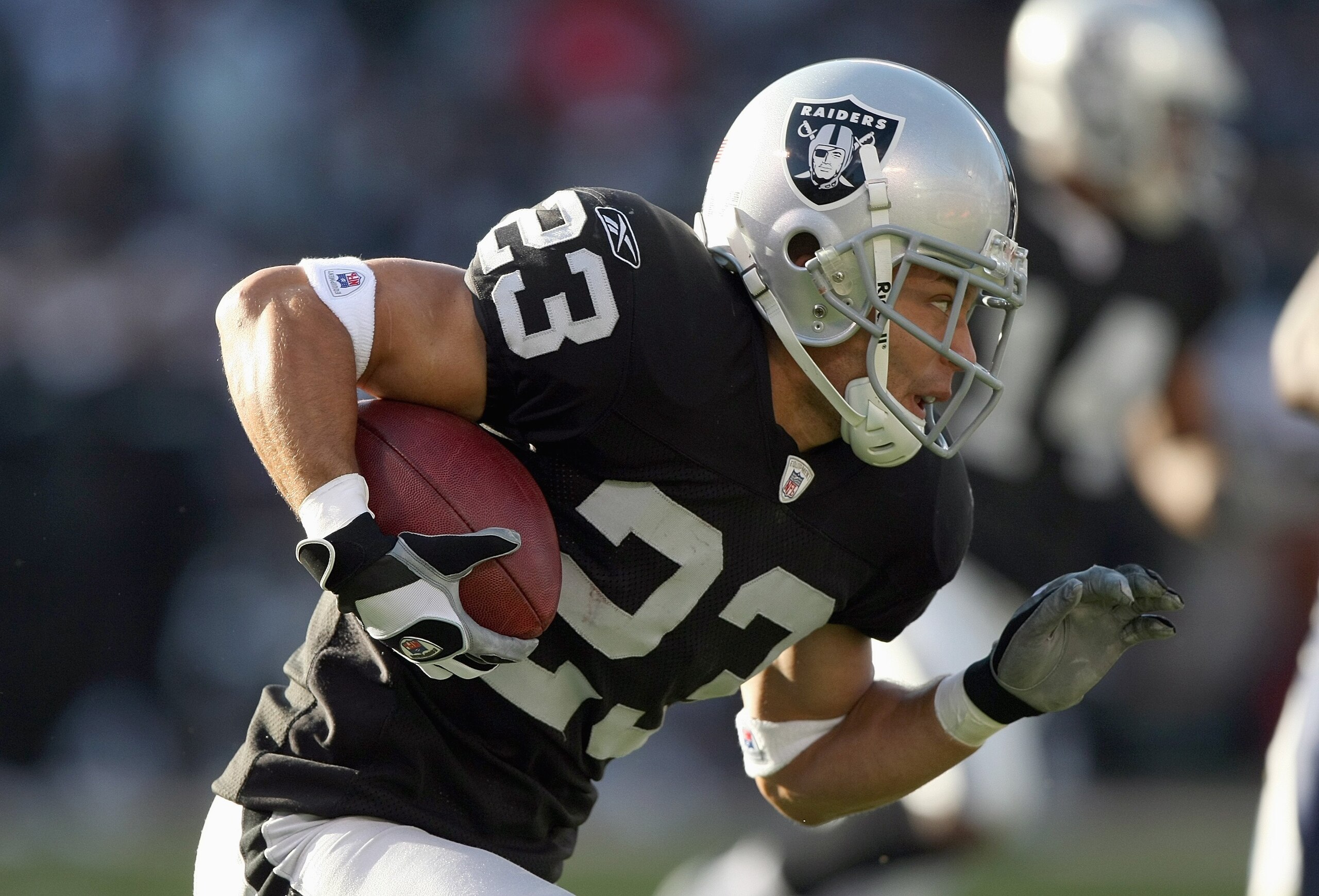 OAKLAND, CA - DECEMBER 30: Chris Carr #23 of the Oakland Raiders carries the ball during an NFL game against the San Diego Chargers on December 30, 2007 at McAfee Coliseum in Oakland, California. (Photo by Jed Jacobsohn/Getty Images)