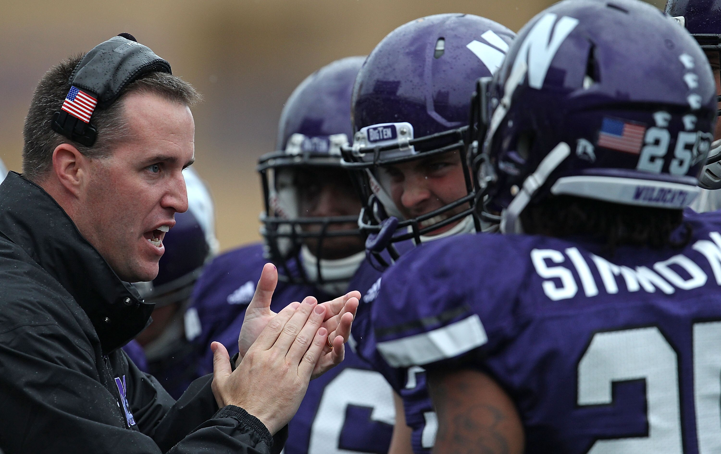 EVANSTON, IL - OCTOBER 23: Head coach Pat Fitzgerald of the Northwestern Wildcats encourages his players during a game against the Michigan State Spartans at Ryan Field on October 23, 2010 in Evanston, Illinois. Michigan State defeated Northwestern 35-27.