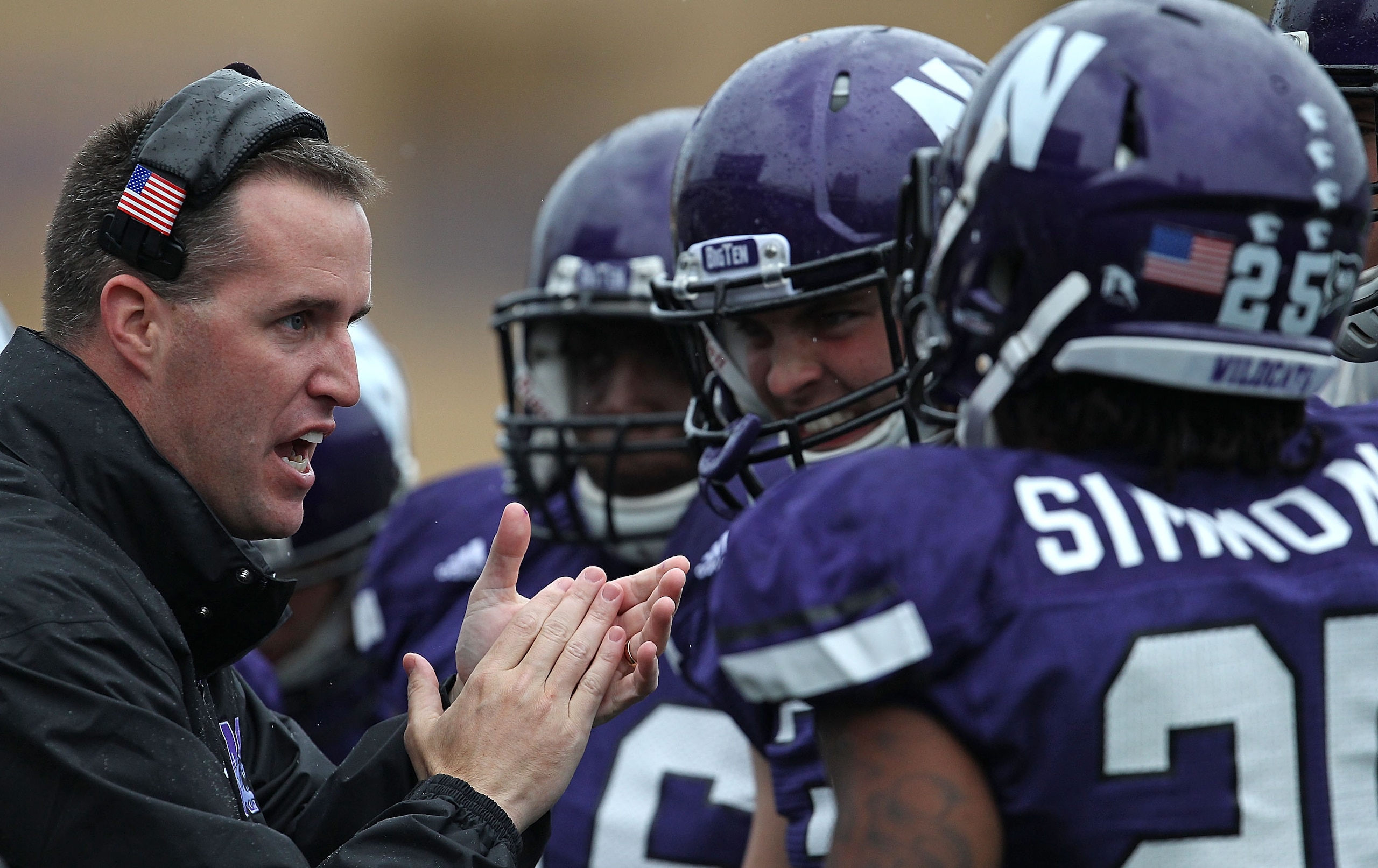 EVANSTON, IL - OCTOBER 23: Head coach Pat Fitzgerald of the Northwestern Wildcats encourages his players during a game against the Michigan State Spartans at Ryan Field on October 23, 2010 in Evanston, Illinois. Michigan State defeated Northwestern 35-27.