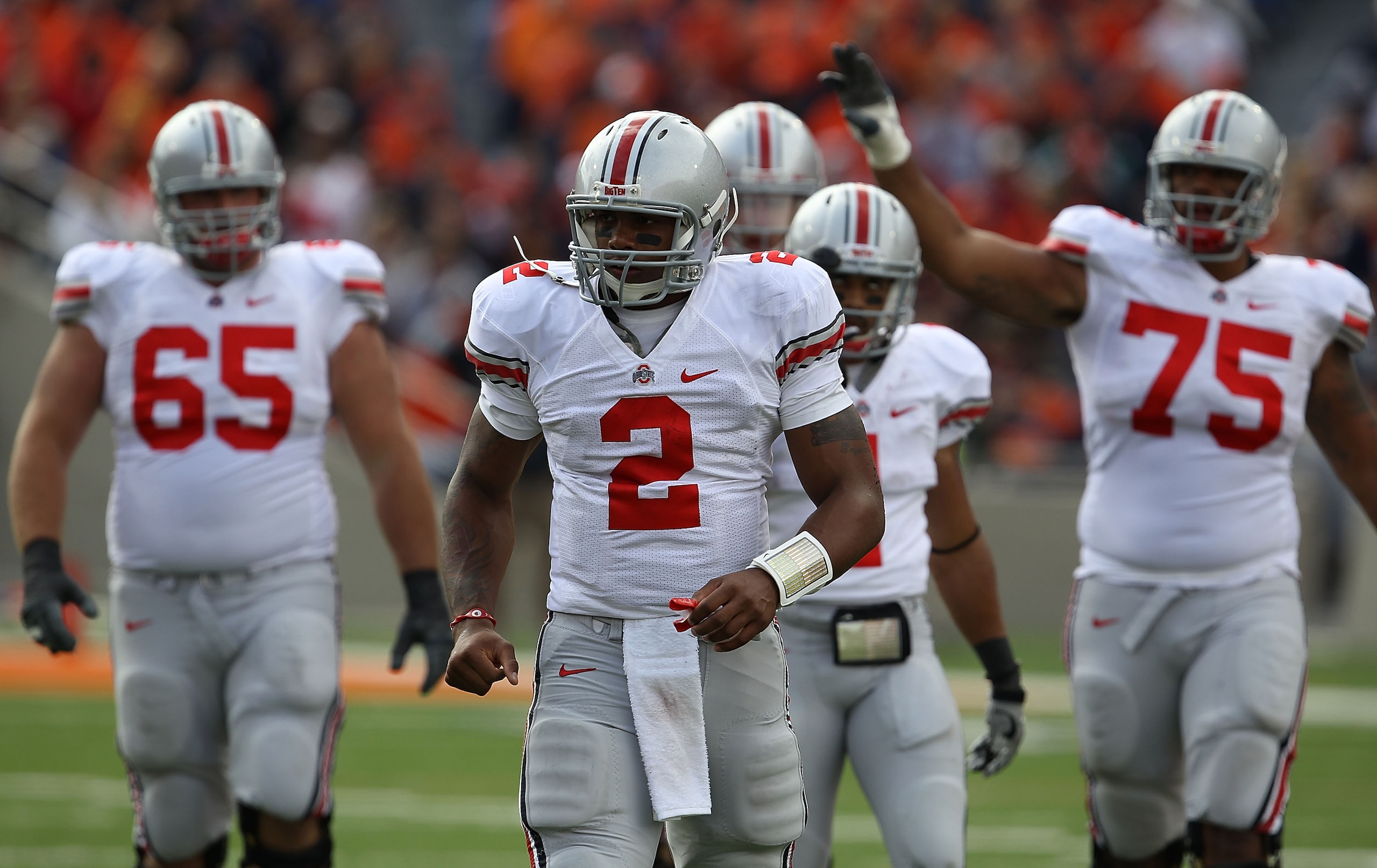 CHAMPAIGN, IL - OCTOBER 02: Terrelle Pryor #2 of the Ohio State Buckeyes leads teammates including Justin Boren #65, Dan Herron #1 and Mike Adams #75 off the field during a game against the Illinois Fighting Illini at Memorial Stadium on October 2, 2010 i