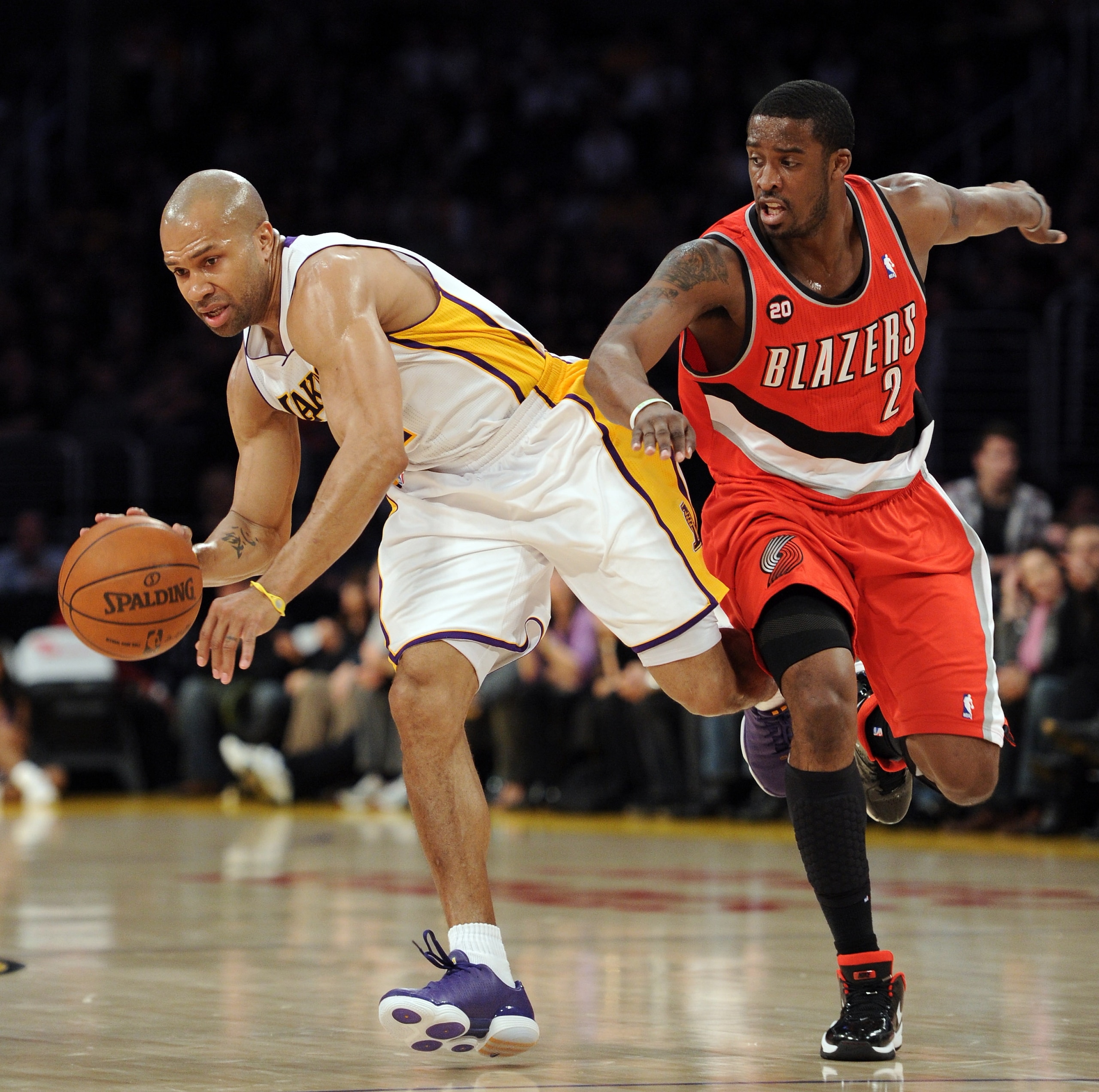 LOS ANGELES, CA - MARCH 20:  Derek Fisher #2 of the Los Angeles Lakers keeps his dribble from Wesley Matthews #2 of the Portland Trail Blazers at the Staples Center on March 20, 2011 in Los Angeles, California.  NOTE TO USER: User expressly acknowledges a