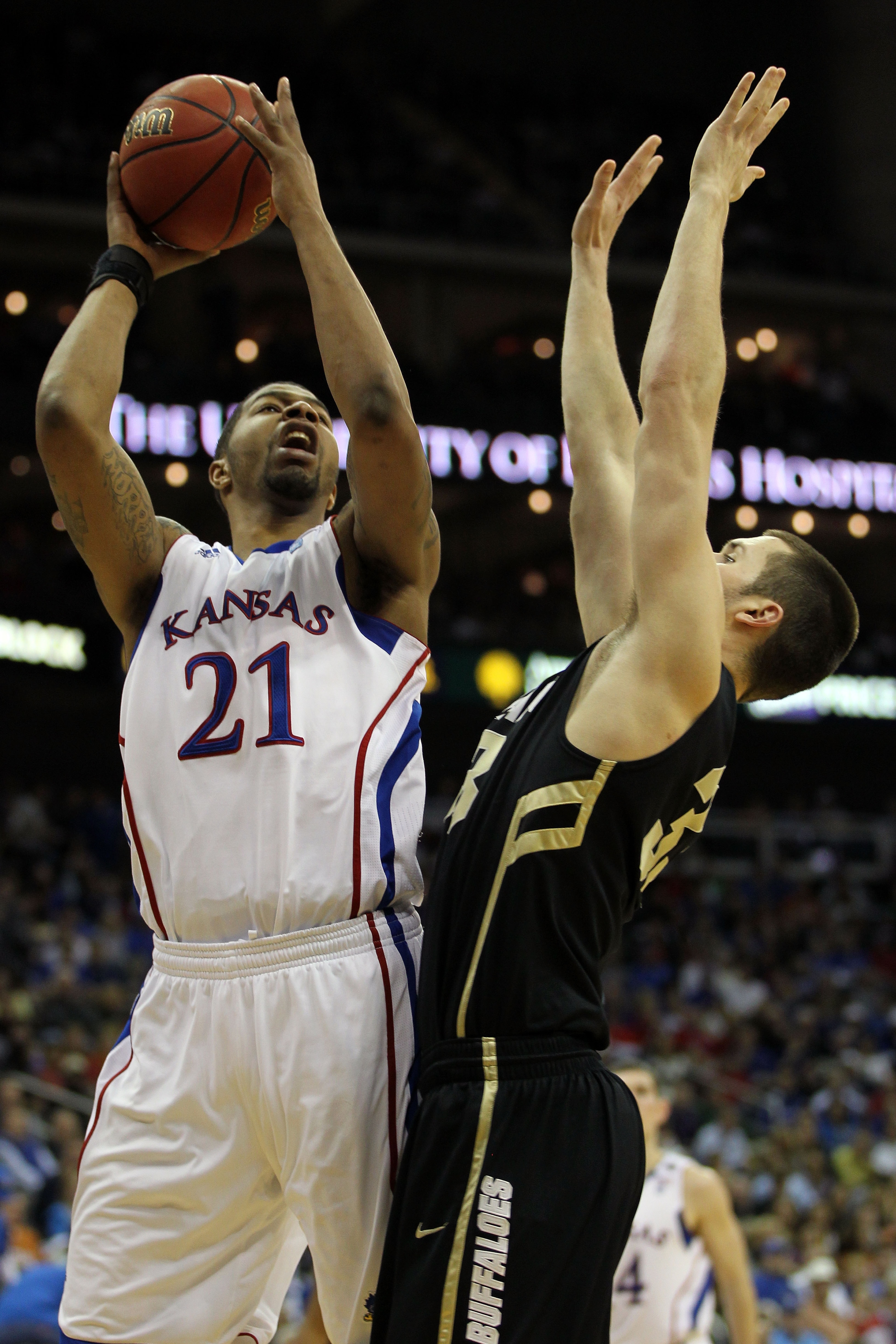 KANSAS CITY, MO - MARCH 11: Markieff Morris #21 of the Kansas Jayhawks goes up for a shot against Austin Dufault #33 of the Colorado Buffaloes during their semifinal game in the 2011 Phillips 66 Big 12 Men's Basketball Tournament at Sprint Center on Marc KANSAS CITY, MO - MARCH 11: Markieff Morris #21 of the Kansas Jayhawks goes up for a shot against Austin Dufault #33 of the Colorado Buffaloes during their semifinal game in the 2011 Phillips 66 Big 12 Men's Basketball Tournament at Sprint Center on Marc