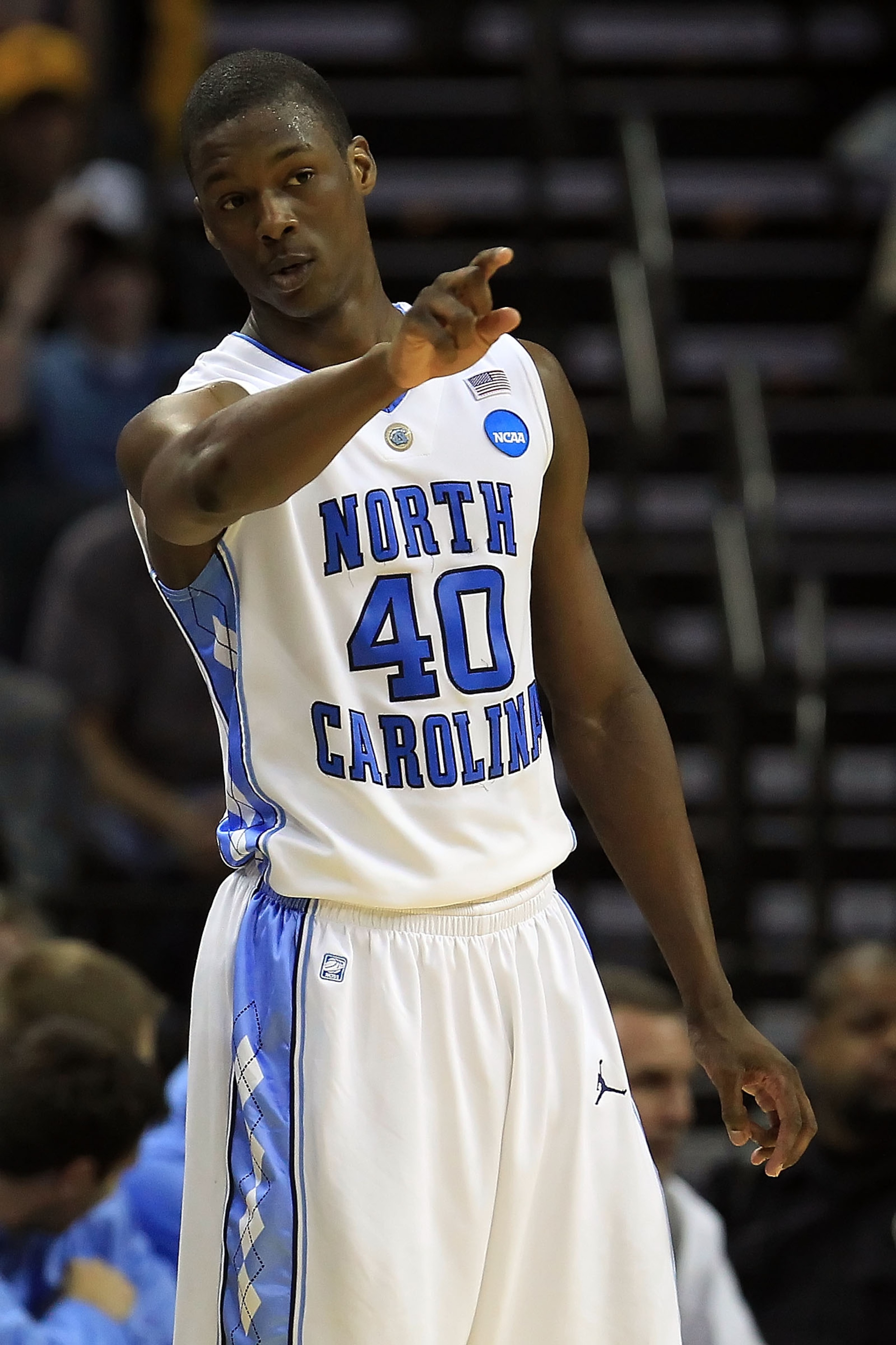 CHARLOTTE, NC - MARCH 20: Harrison Barnes #40 of the North Carolina Tar Heels points in the second half while taking on the Washington Huskies during the third round of the 2011 NCAA men's basketball tournament at Time Warner Cable Arena on March 20, 201 CHARLOTTE, NC - MARCH 20: Harrison Barnes #40 of the North Carolina Tar Heels points in the second half while taking on the Washington Huskies during the third round of the 2011 NCAA men's basketball tournament at Time Warner Cable Arena on March 20, 201