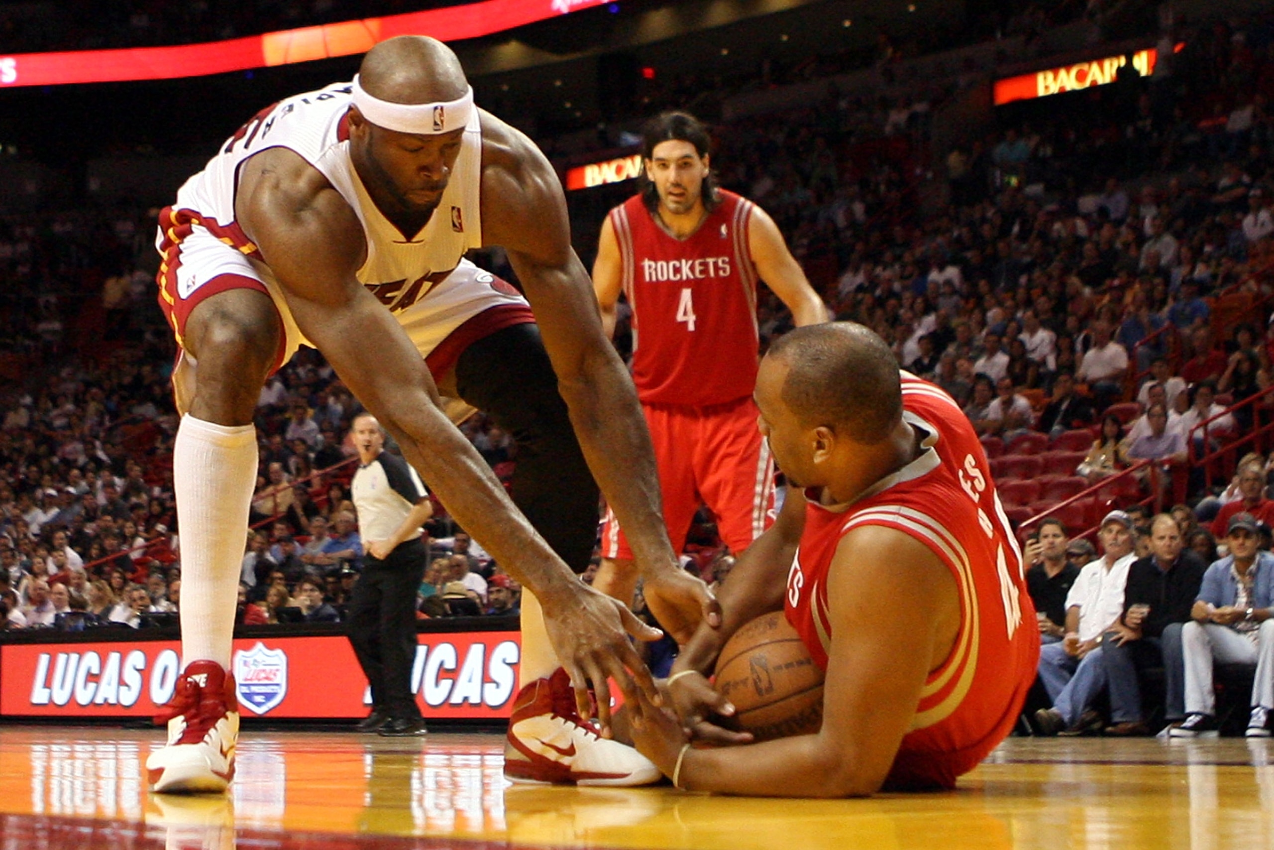 MIAMI, FL - MARCH 27: Center Erick Dampier #25 of the Miami Heat defends against Center Chuck Hayes #44 of the Houston Rockets  at American Airlines Arena on March 27, 2011 in Miami, Florida. NOTE TO USER: User expressly acknowledges and agrees that, by d