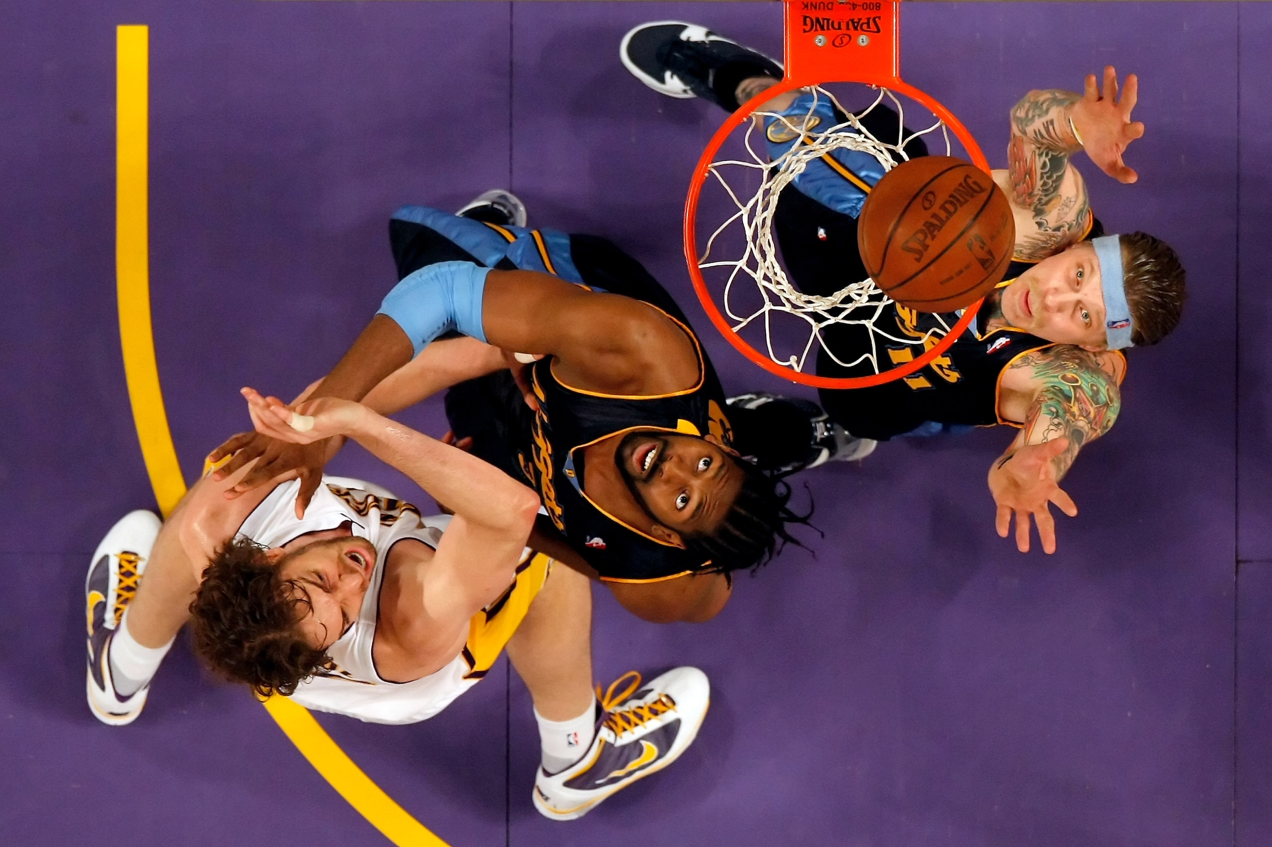 LOS ANGELES, CA - FEBRUARY 28:  (L-R) Pau Gasol #16 of the Los Angeles Lakers, Nene #31 of the Denver Nuggets and Chris Andersen #11 of the Nuggets fight for a rebound during the game at Staples Center on February 28, 2010 in Los Angeles, California. The