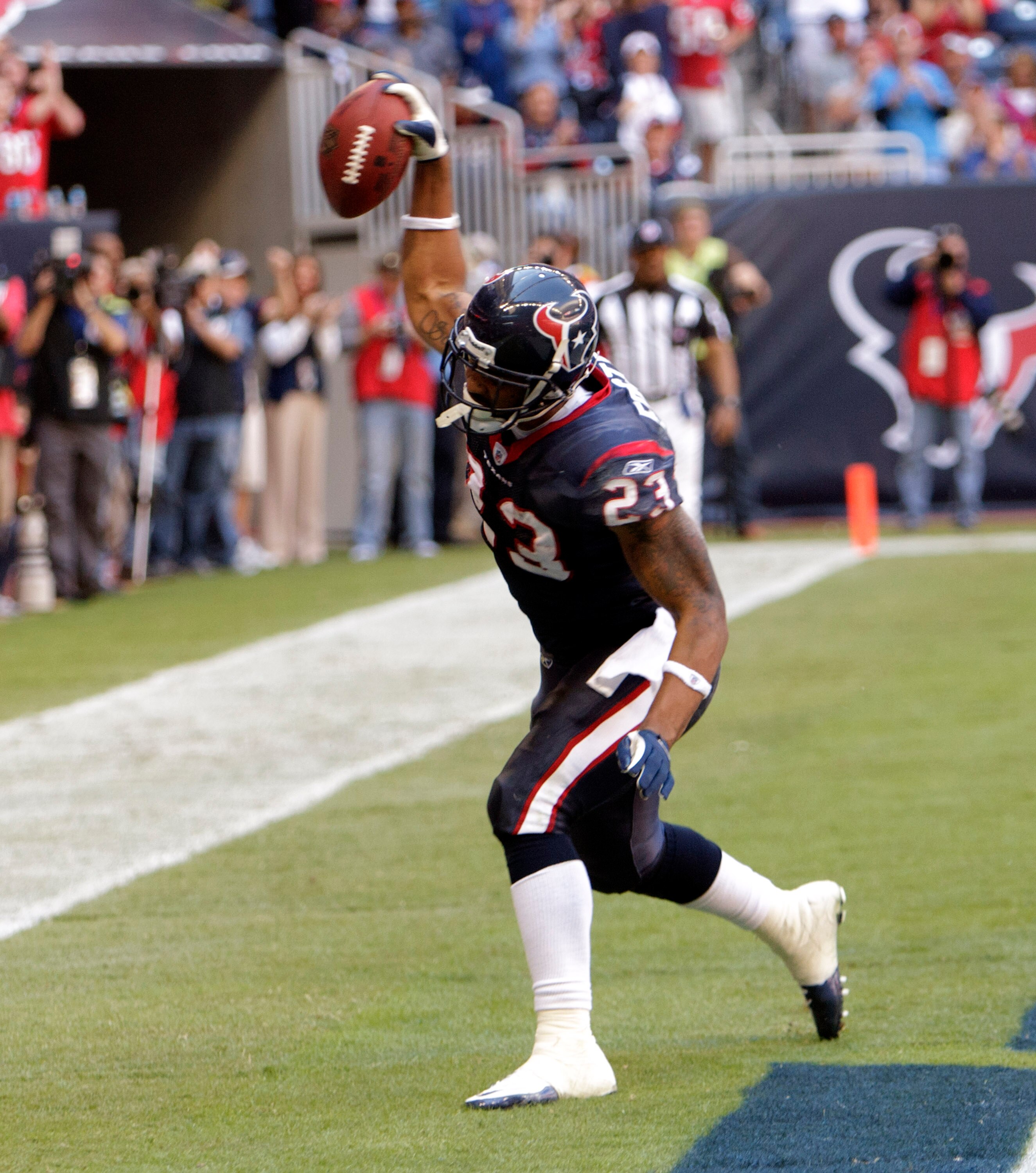 HOUSTON - NOVEMBER 07:  Running back Arian Foster #23 scores against the San Diego Chargers at Reliant Stadium on November 7, 2010 in Houston, Texas.  (Photo by Bob Levey/Getty Images)