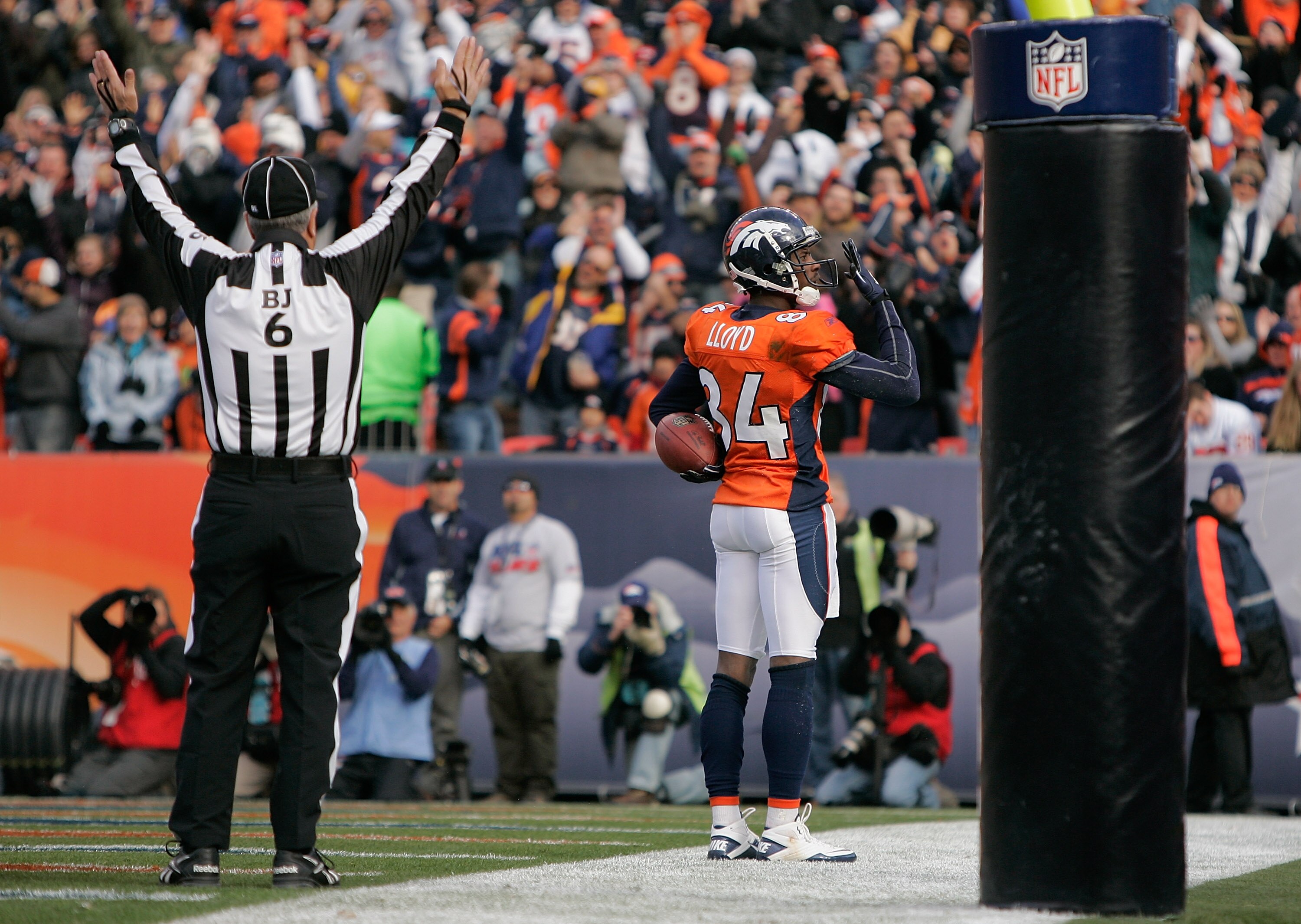 DENVER - NOVEMBER 14:  Wide receiver Brandon Lloyd #84 of the Denver Broncos celebrates 6-yard touchdown reception against the Kansas City Chiefs during the first quarter at INVESCO Field at Mile High on November 14, 2010 in Denver, Colorado. The Denver B