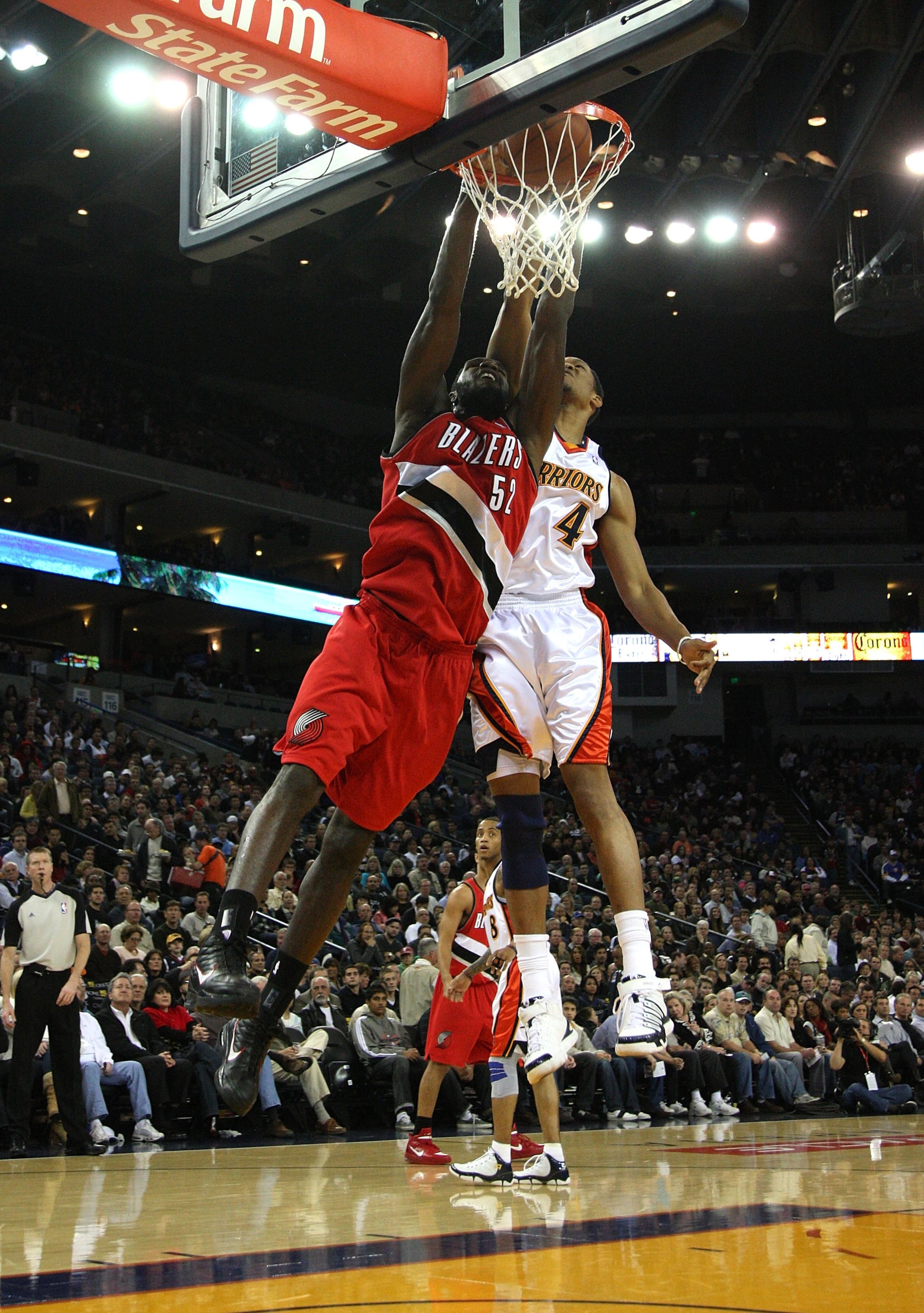 OAKLAND, CA - NOVEMBER 20:  Greg Oden #52 of the Portland Trail Blazers dunks over Anthony Randolph #4 of the Golden State Warriors during an NBA game at Oracle Arena on November 20, 2009 in Oakland, California.  (Photo by Jed Jacobsohn/Getty Images)