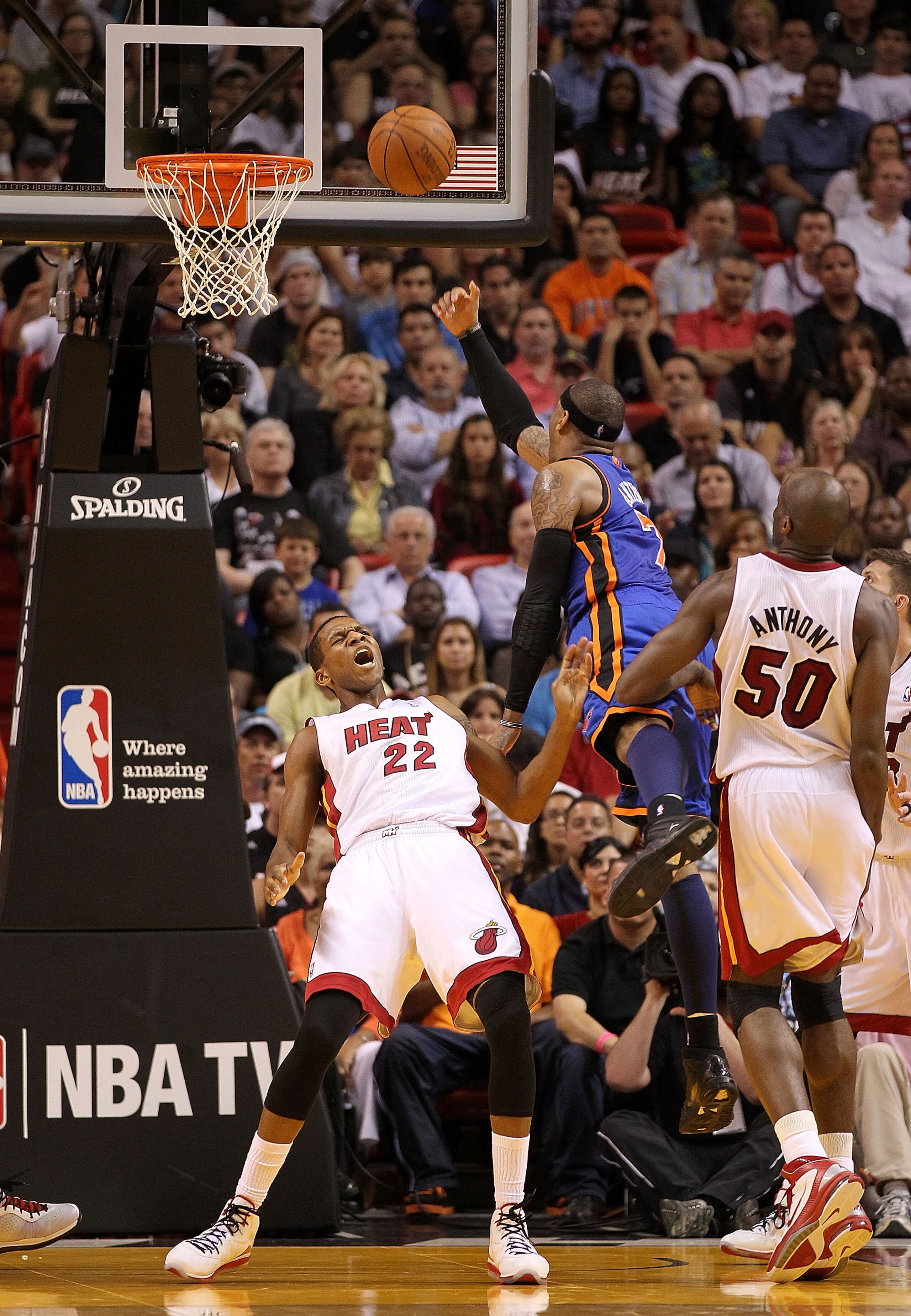 MIAMI, FL - FEBRUARY 27: James Jones #22 of the Miami Heat takes a charge against Carmelo Anthony #7 of the New York Knicks during a game at American Airlines Arena on February 27, 2011 in Miami, Florida. NOTE TO USER: User expressly acknowledges and agre