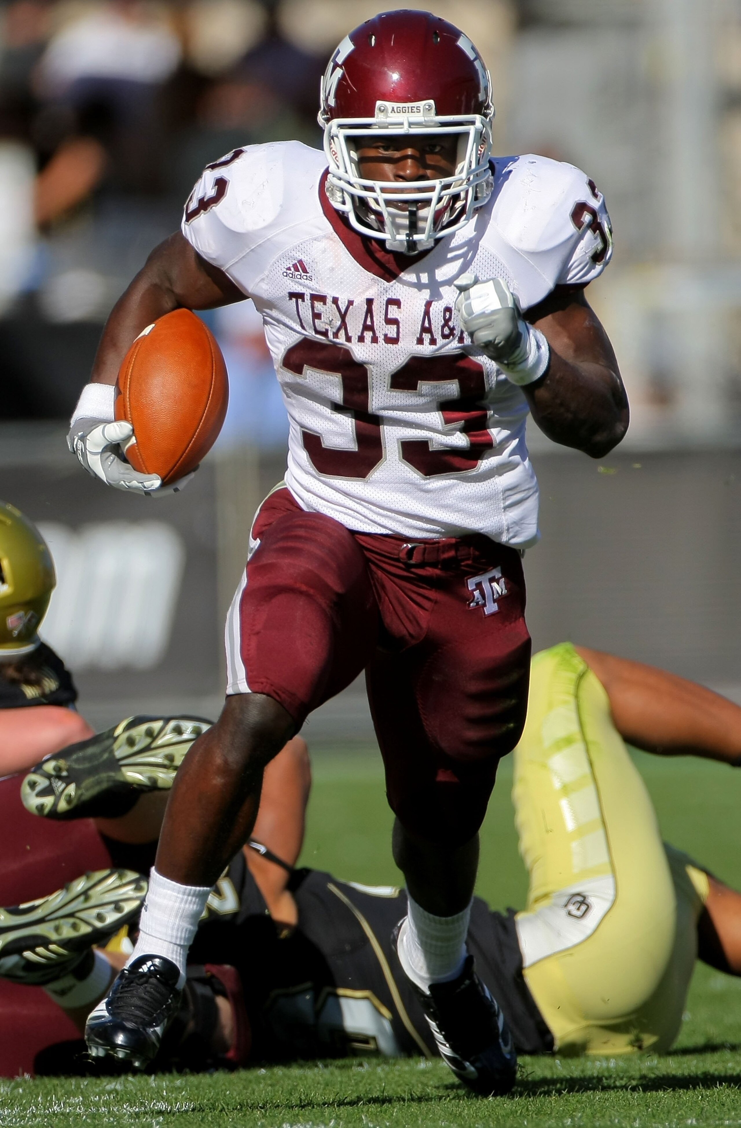 BOULDER, CO - NOVEMBER 07:  Running back Christine Michael #33 of the Texas A&M Aggies rushes against the Colorado Buffaloes during NCAA college football action at Folsom Field on November 7, 2009 in Boulder, Colorado. Colorado defeated Texas A&M 35-34.