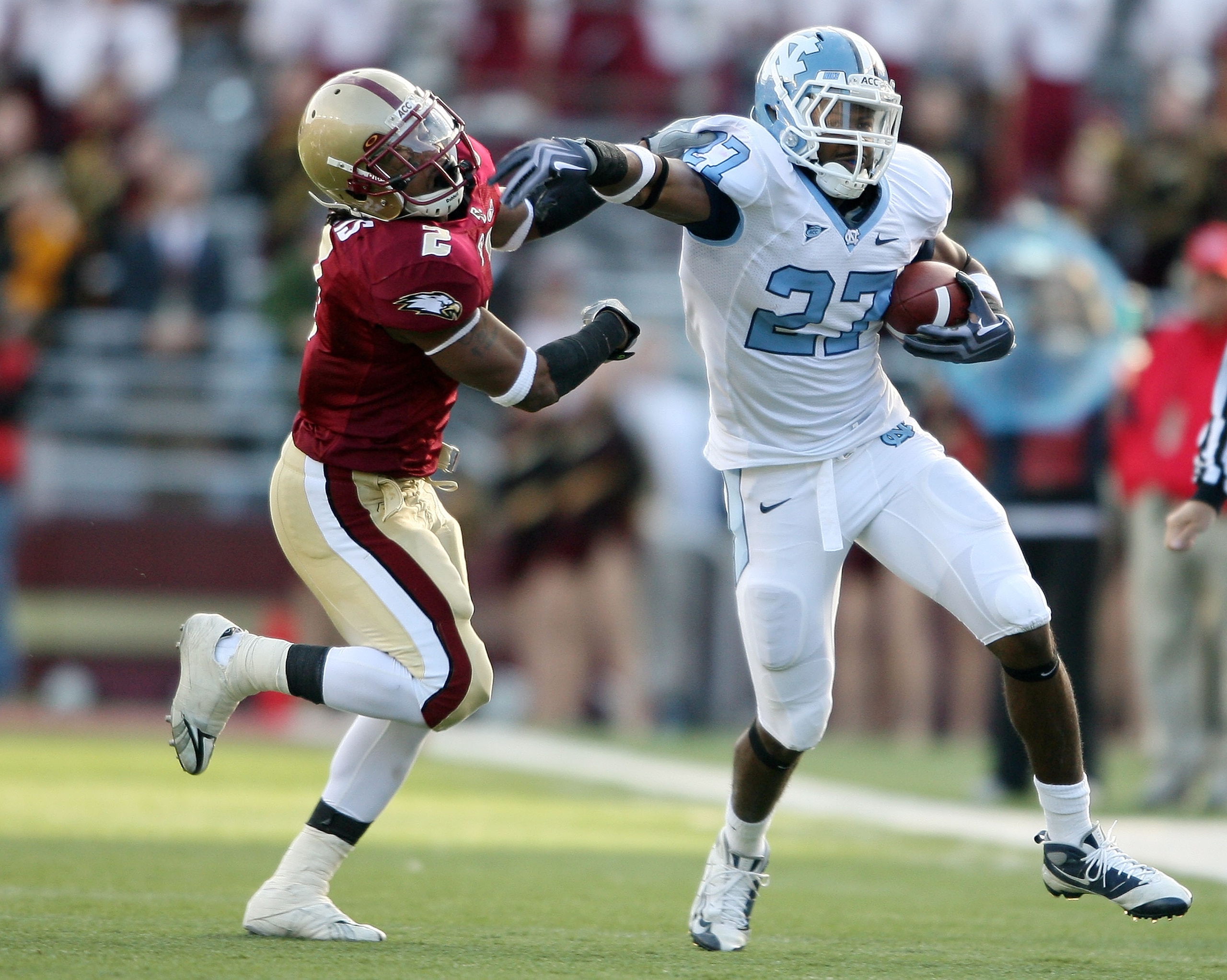 CHESTNUT HILL, MA - NOVEMBER 21: Deunta Williams #27 of the North Carolina Tar Heels carries the ball as Montel Harris #2 of the Boston College Eagles tries to make the stop on November 21, 2009 at Alumni Stadium in Chestnut Hill, Massachusetts. The Tar CHESTNUT HILL, MA - NOVEMBER 21: Deunta Williams #27 of the North Carolina Tar Heels carries the ball as Montel Harris #2 of the Boston College Eagles tries to make the stop on November 21, 2009 at Alumni Stadium in Chestnut Hill, Massachusetts. The Tar