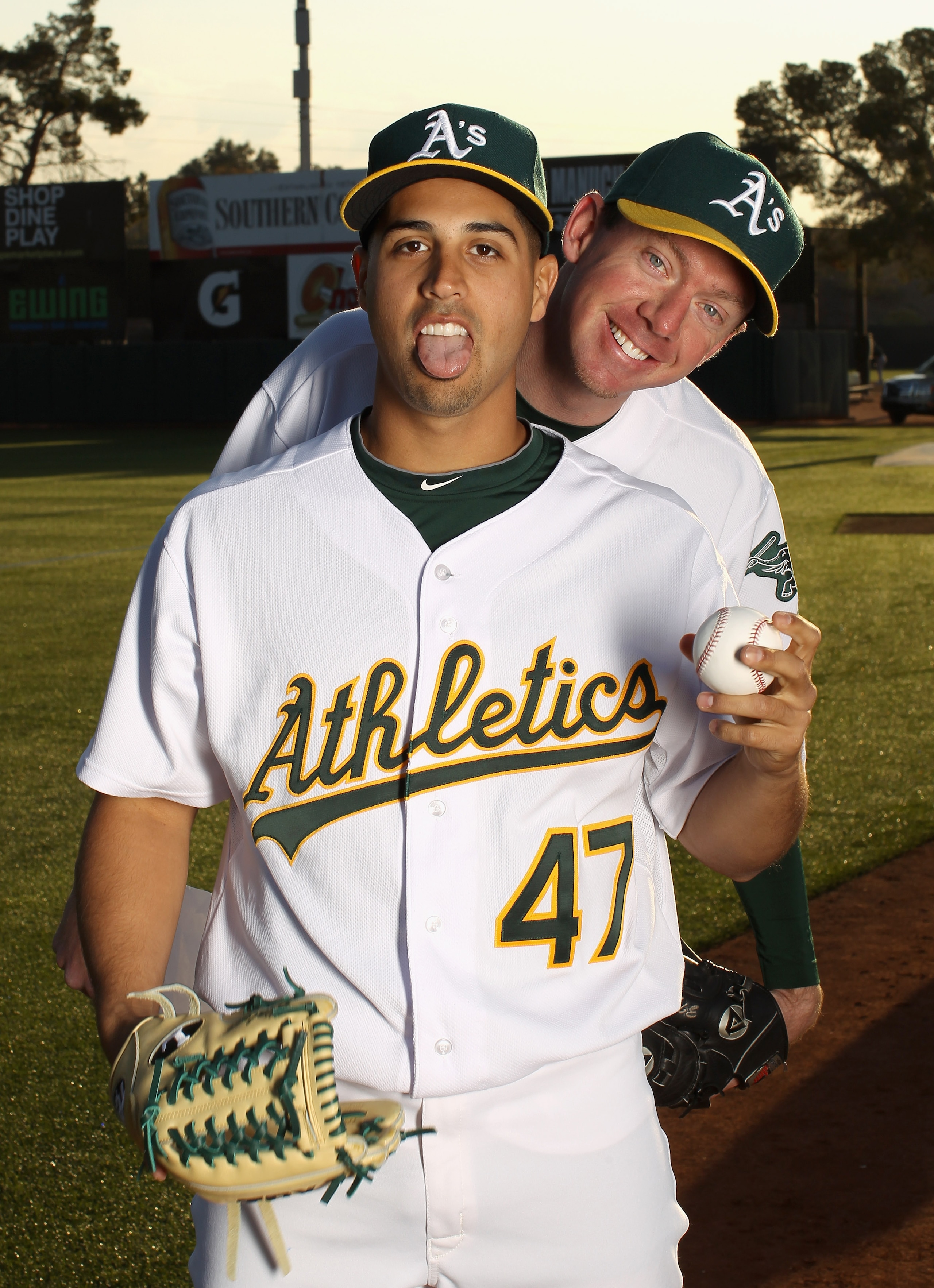 PHOENIX, AZ - FEBRUARY 24:  Gio Gonzalez #47 and Brad Ziegler #31 of the Oakland Athletics joke around during media photo day at Phoenix Municipal Stadium on February 24, 2011 in Phoenix, Arizona.  (Photo by Ezra Shaw/Getty Images)
