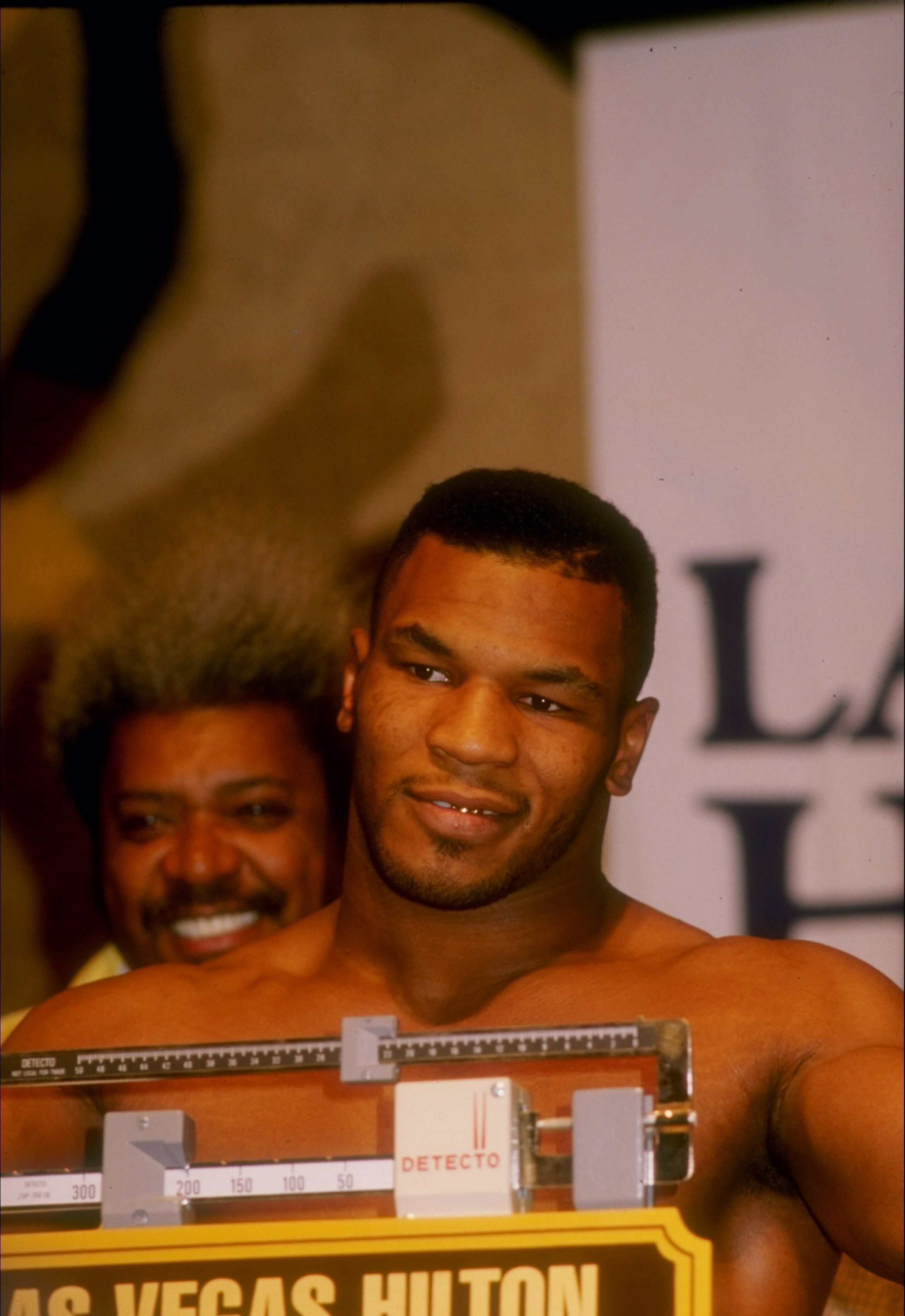 22 Nov 1986:  Mike Tyson listens to reporters during the weigh in for his fight against Trevor Berbick in Las Vegas, Nevada. Mandatory Credit: Allsport  /Allsport