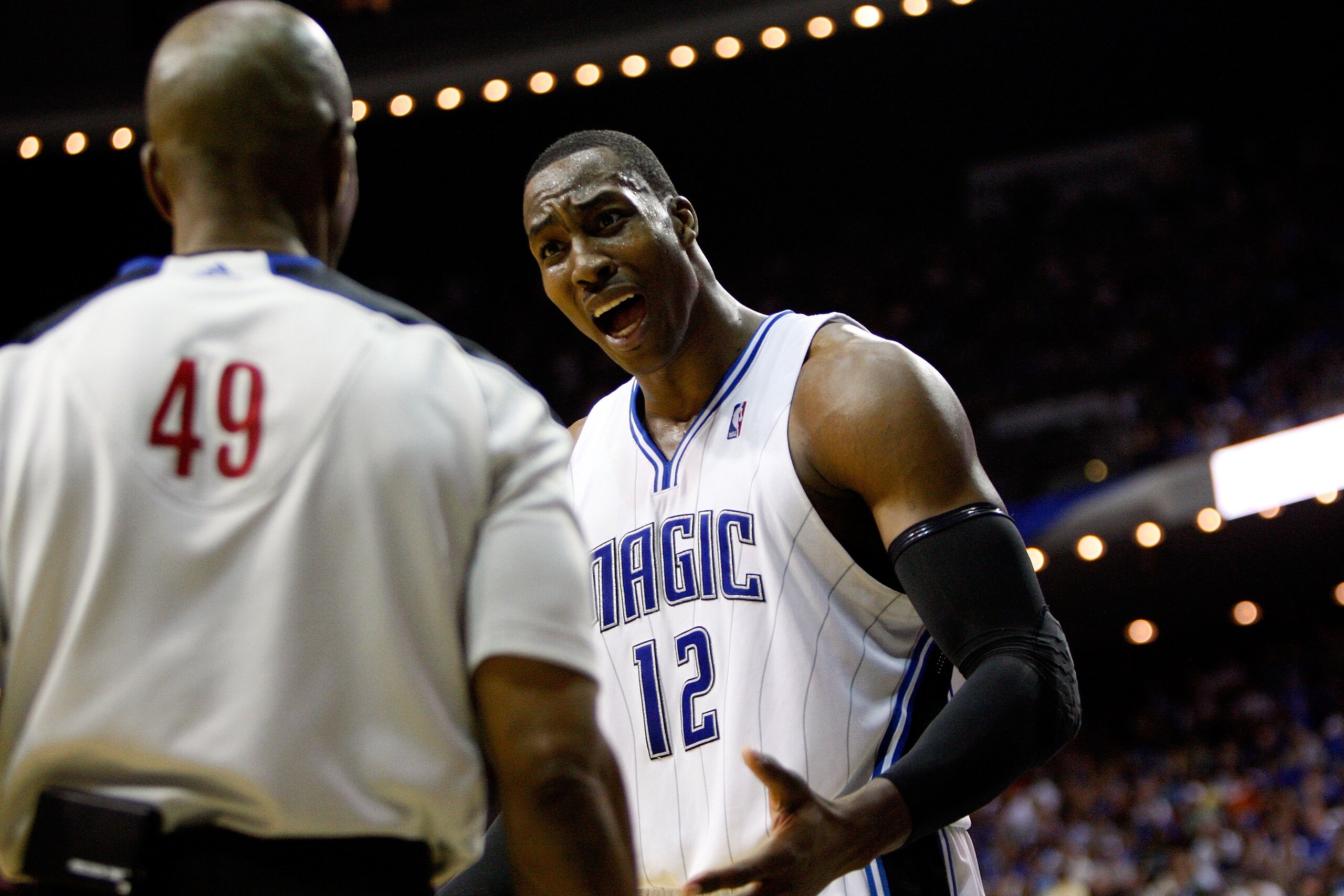 ORLANDO, FL - MAY 26:  Dwight Howard #12 of the Orlando Magic talks with referee Tom Washington against the Boston Celtics in Game Five of the Eastern Conference Finals during the 2010 NBA Playoffs at Amway Arena on May 26, 2010 in Orlando, Florida.  NOTE
