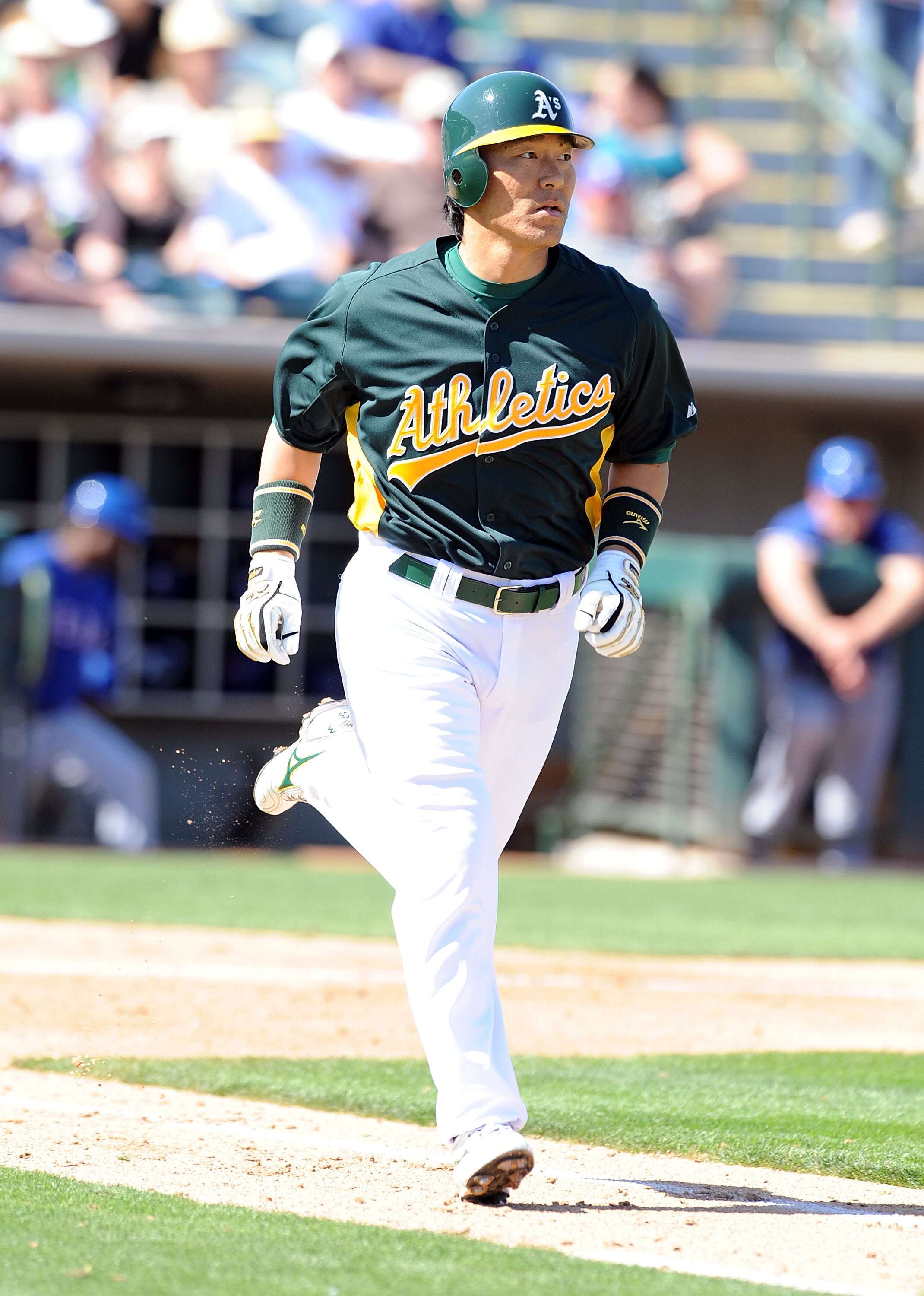 PHOENIX, AZ - MARCH 04:  Hideki Matsui #55 of the Oakland Athletics runs to first base after being walked by the Texas Rangers at Phoenix Municipal Stadium on March 4, 2011 in Phoenix, Arizona.  (Photo by Norm Hall/Getty Images)