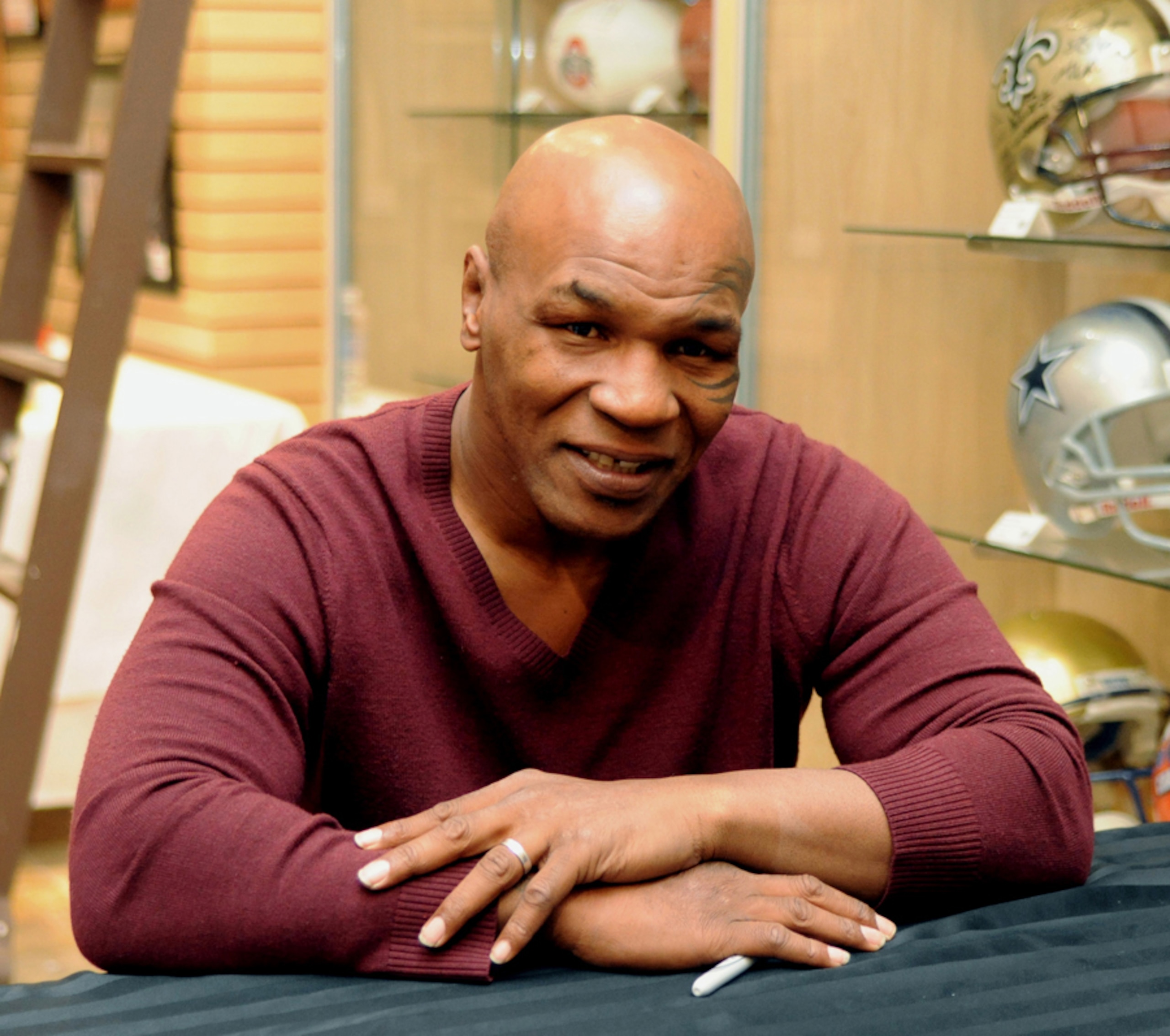LAS VEGAS - FEBRUARY 4:  In this handout photo provided by Las Vegas News Bureau, former heavyweight boxing champion Mike Tyson attends an autograph-signing session  in the Miracle Mile Shops at Planet Hollywood Resort & Casino on February 4, 2011 in Las