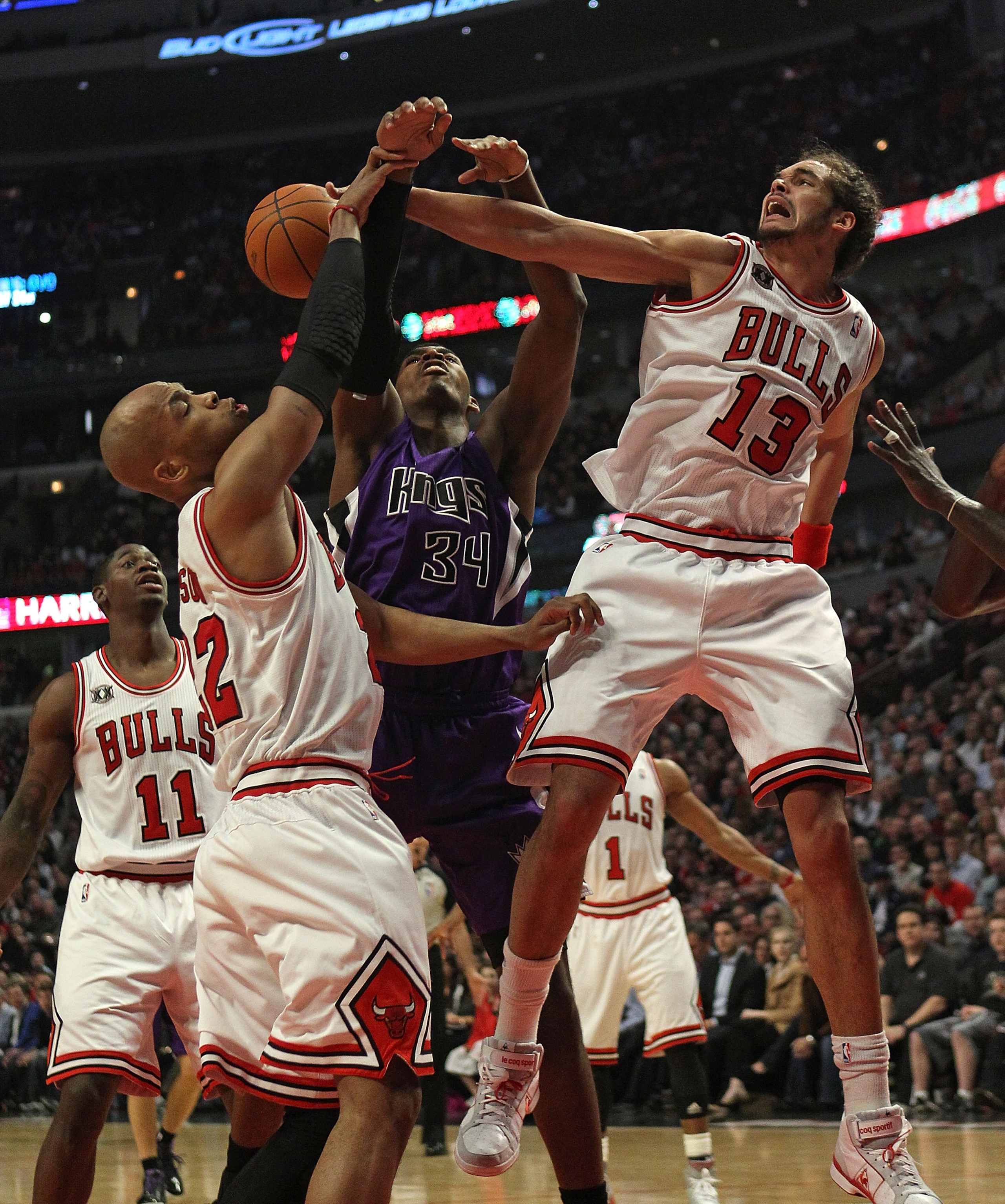 CHICAGO, IL - MARCH 21: Joakim Noah #13 of the Chicago Bulls blocks a shot by Jason Thompson #34 of the Sacramento Kings as teammate Taj Gibson #22 also defends at the United Center on March 21, 2011 in Chicago, Illinois. NOTE TO USER: User expressly ackn CHICAGO, IL - MARCH 21: Joakim Noah #13 of the Chicago Bulls blocks a shot by Jason Thompson #34 of the Sacramento Kings as teammate Taj Gibson #22 also defends at the United Center on March 21, 2011 in Chicago, Illinois. NOTE TO USER: User expressly ackn