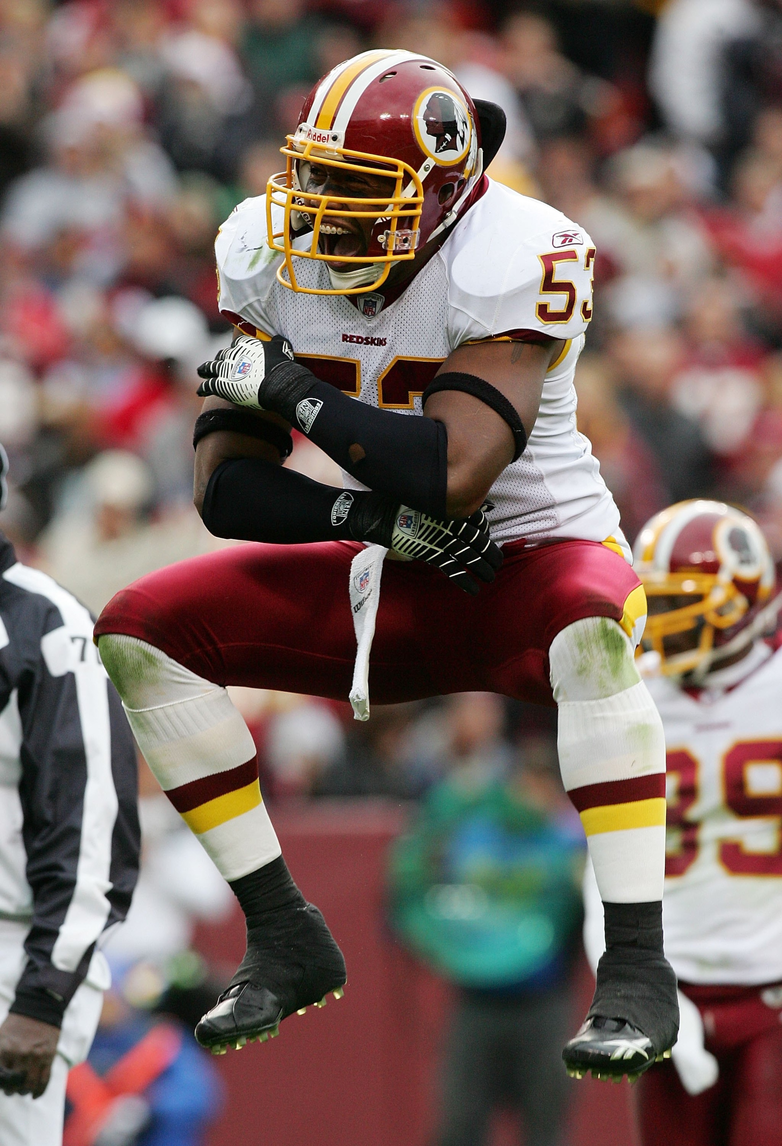 LANDOVER, MD - DECEMBER 03:   Marcus Washington #53 of the Washington Redskins tries to fire up the crowd before a play against the Atlanta Falcons December 3, 2006 at FedEx Field in Landover, Maryland.The Falcons defeated the Redskins, 24-14.  (Photo by