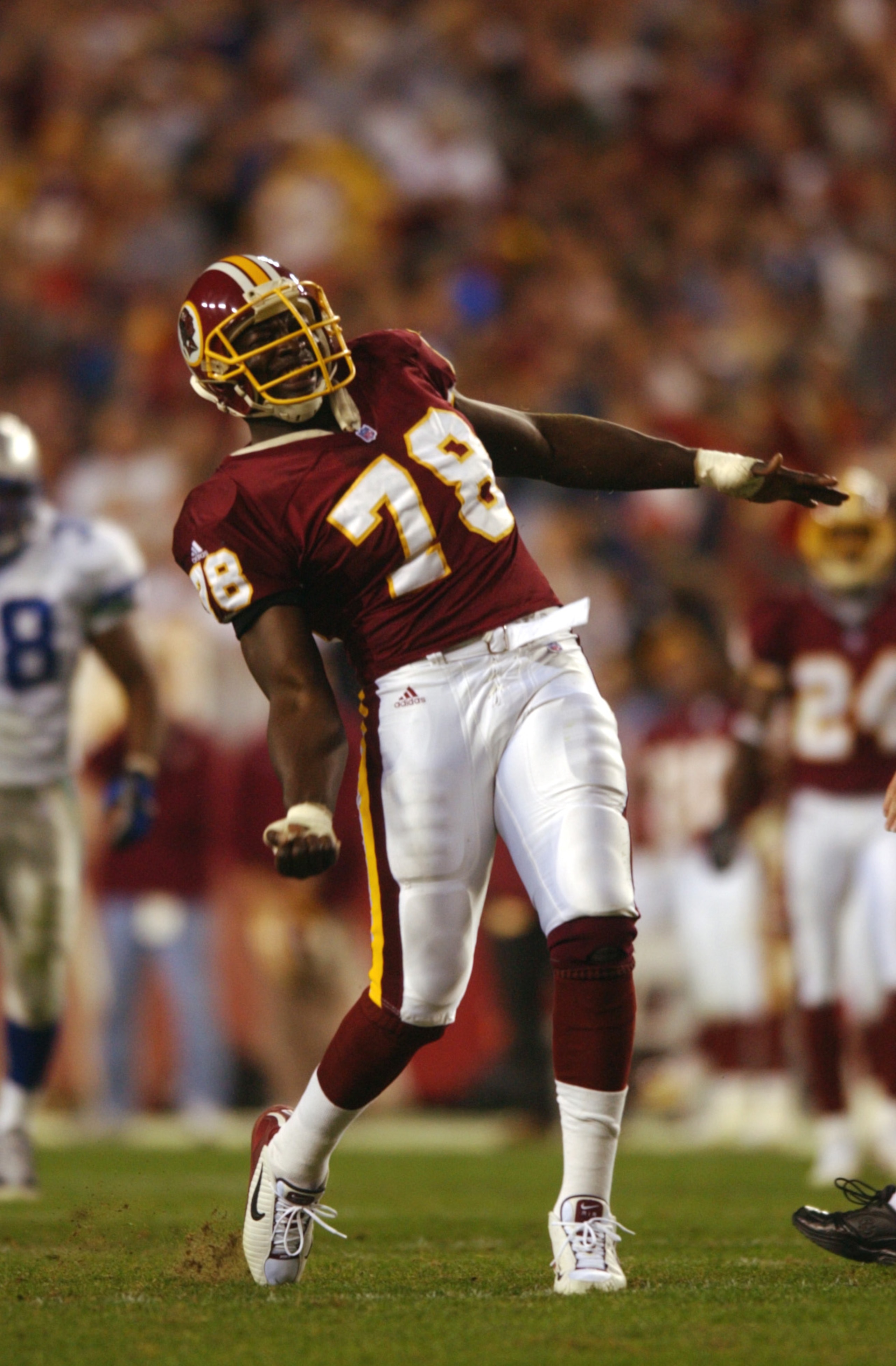 4 Nov 2001 : Bruce Smith of the Washington Redskins celebrates after sacking quarterback Matt Hasselbeck of the Seattle Seahawks during the game at FedEx Field in Landover, Maryland. The Redskins won 27-14. DIGITAL IMAGE. Mandatory Credit: Doug Pensinger/
