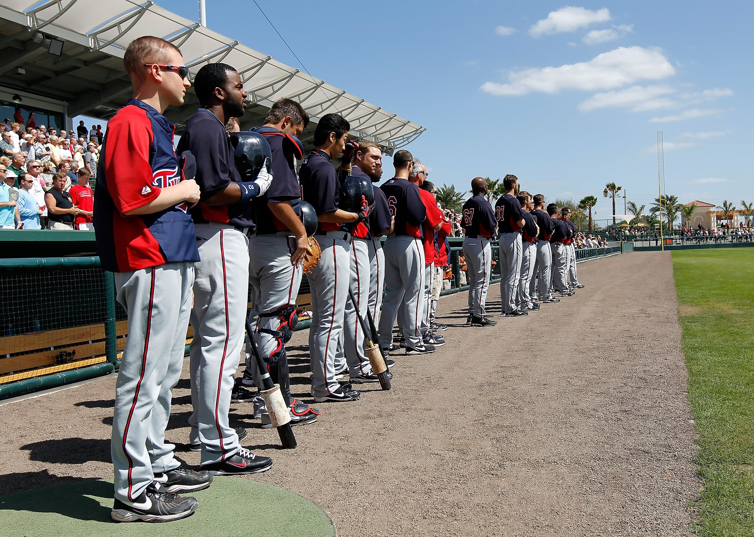 SARASOTA, FL - MARCH 03:  The Minnesota Twins line up for the National Anthem just before the start of the Grapefruit League Spring Training Game against the Baltimore Orioles at Ed Smith Stadium on March 3, 2011 in Sarasota, Florida.  (Photo by J. Meric/