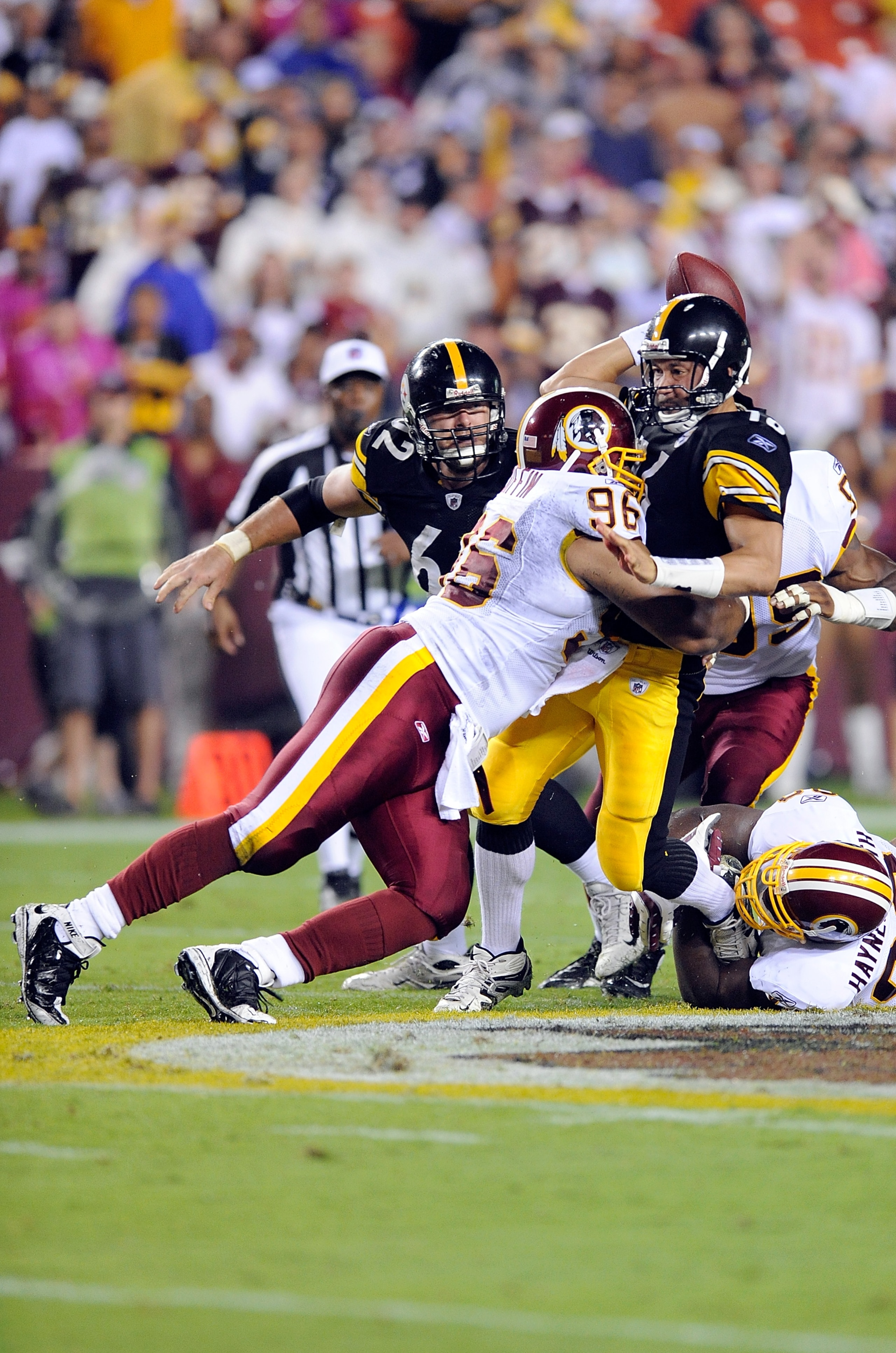 LANDOVER, MD - AUGUST 22:  Charlie Batch #16 of the Pittsburgh Steelers is hit by Cornelius Griffin #96 of the Washington Redskins at Fed Ex Field on August 22, 2009 in Landover, Maryland.  (Photo by Greg Fiume/Getty Images)