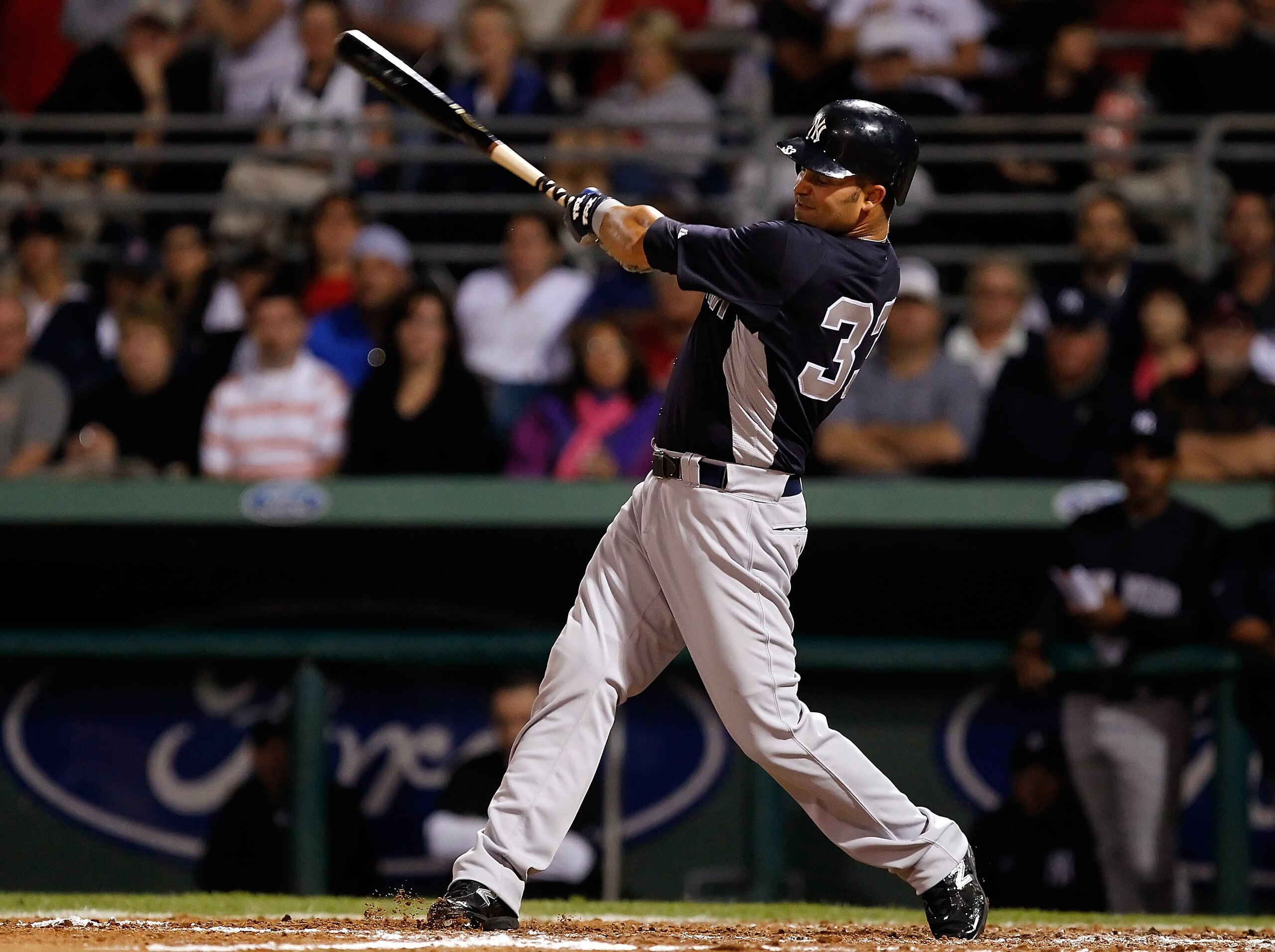 FORT MYERS, FL - MARCH 14:  Outfielder Nick Swisher #33 of the New York Yankees fouls off a pitch against the Boston Red Sox during a Grapefruit League Spring Training Game at City of Palms Park on March 14, 2011 in Fort Myers, Florida.  (Photo by J. Meri