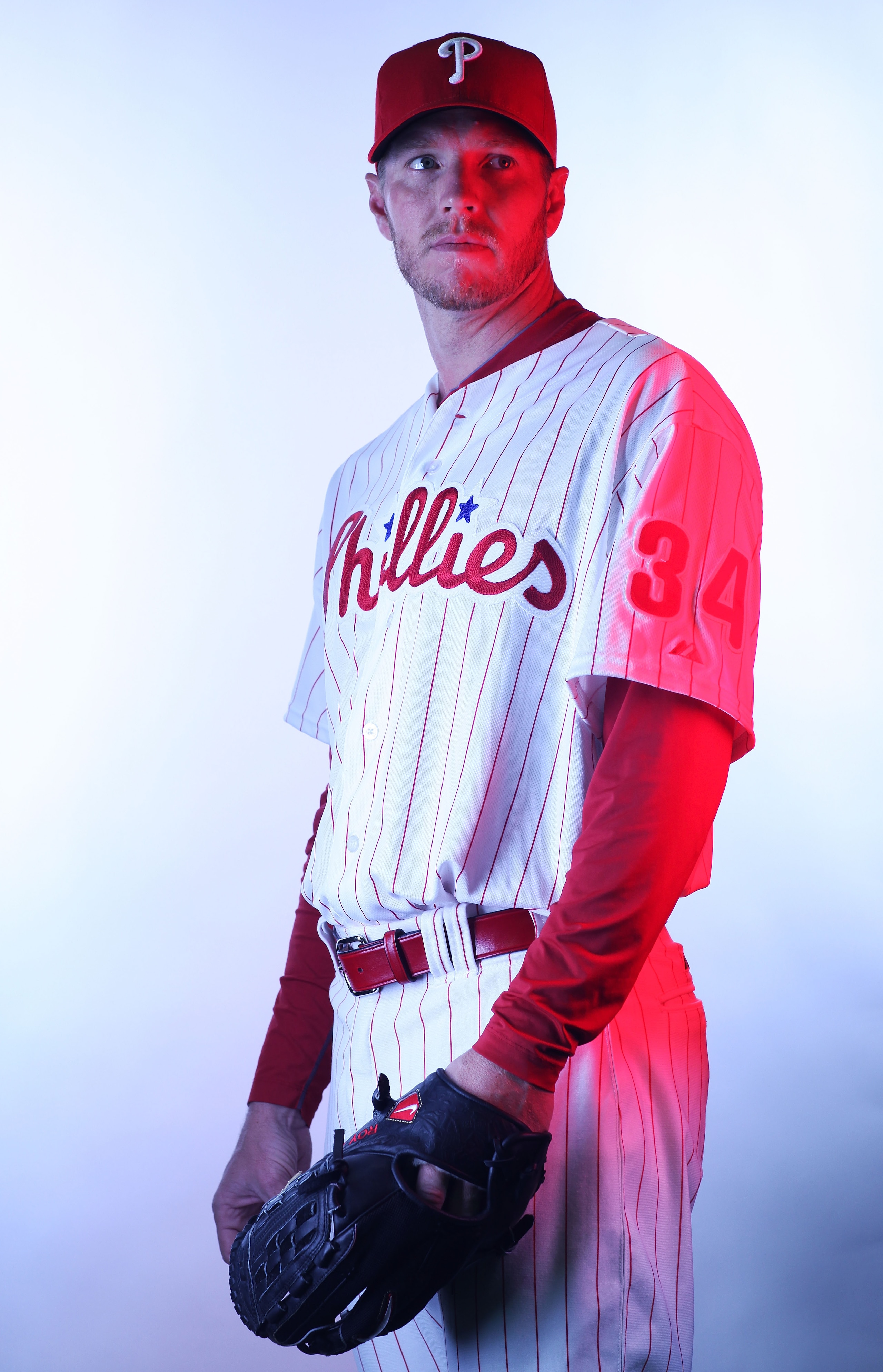CLEARWATER, FL - FEBRUARY 22:  (EDITORS NOTE: Image was shot with a colored gel on lights) Roy Halladay #34 of the Philadelphia Phillies poses for a photo during Spring Training Media Photo Day at Bright House Networks Field on February 22, 2011 in Clearw