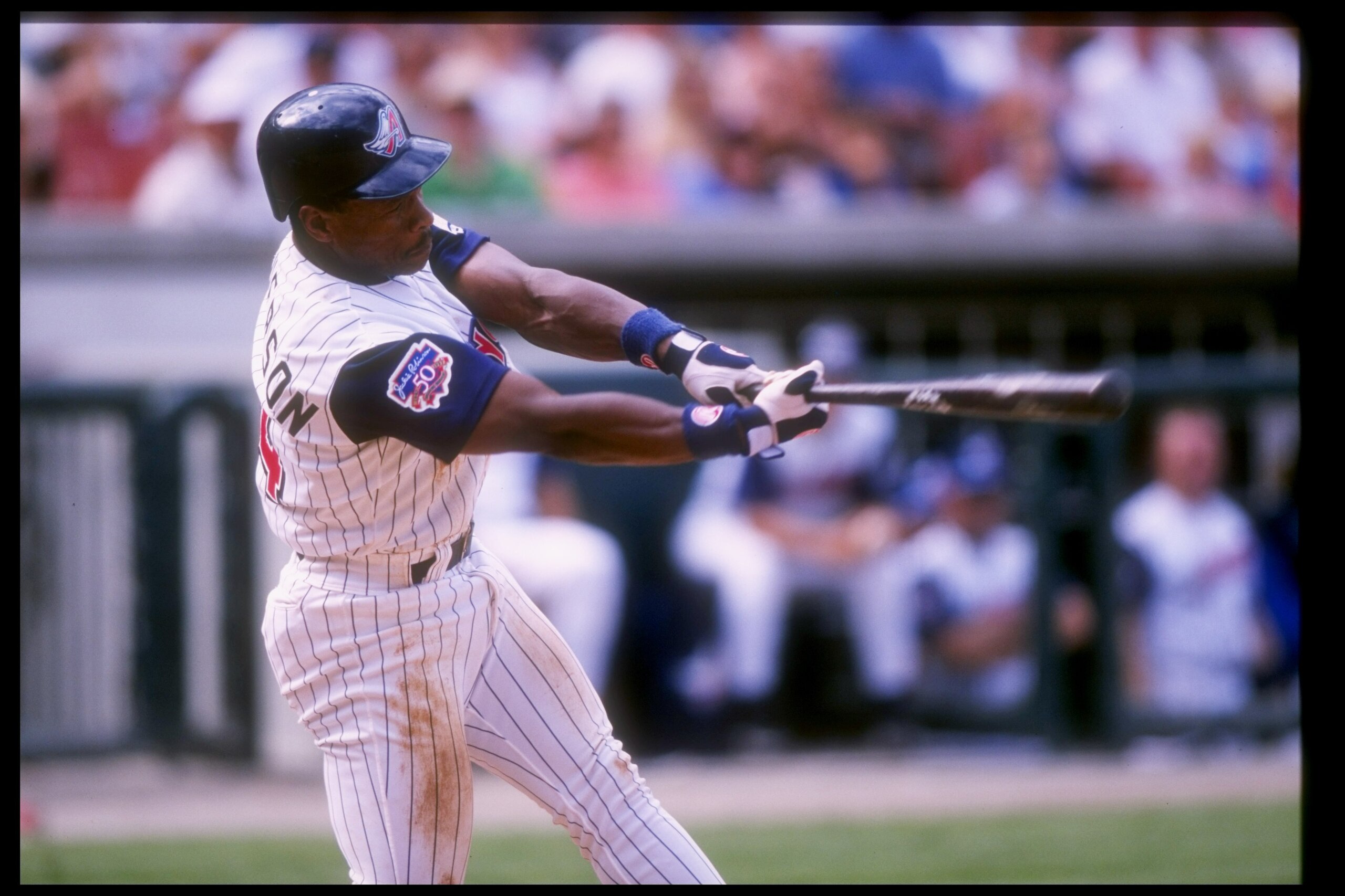 14 Sep 1997:  Rickey Henderson of the Anaheim Angels swings at the ball during a game against the Kansas City Royals at Anaheim Stadium in Anaheim, California.  The Angels won the game, 3-2. Mandatory Credit: Jon Ferrey  /Allsport