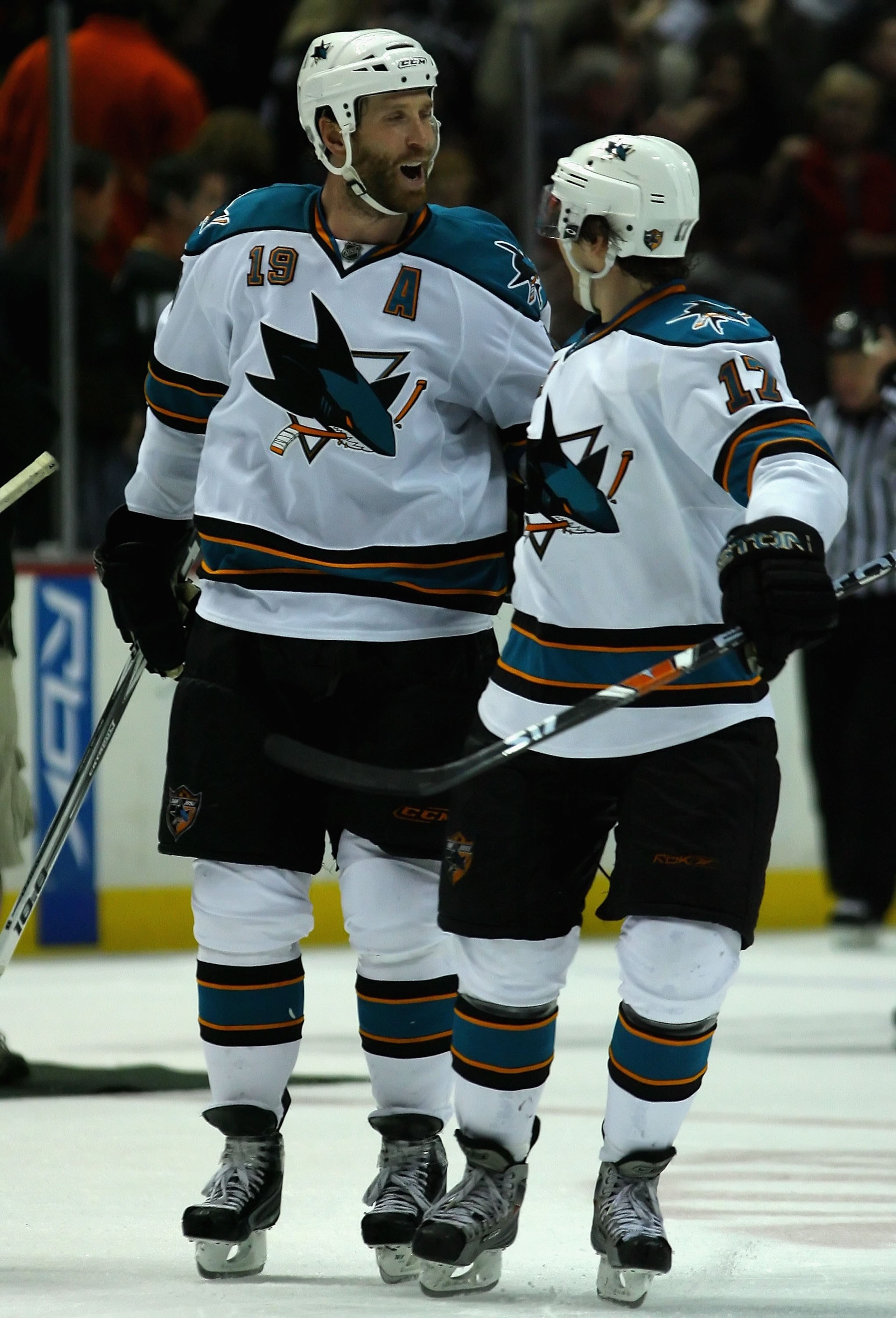 ANAHEIM, CA - DECEMBER 16:  Joe Thornton #19 of the San Jose Sharks celebrates with teammates Torrey Mitchell #17 after scoring the game winning goal in a shoot out against the Anaheim Ducks during the NHL game at Honda Center on December 16, 2007 in Anah