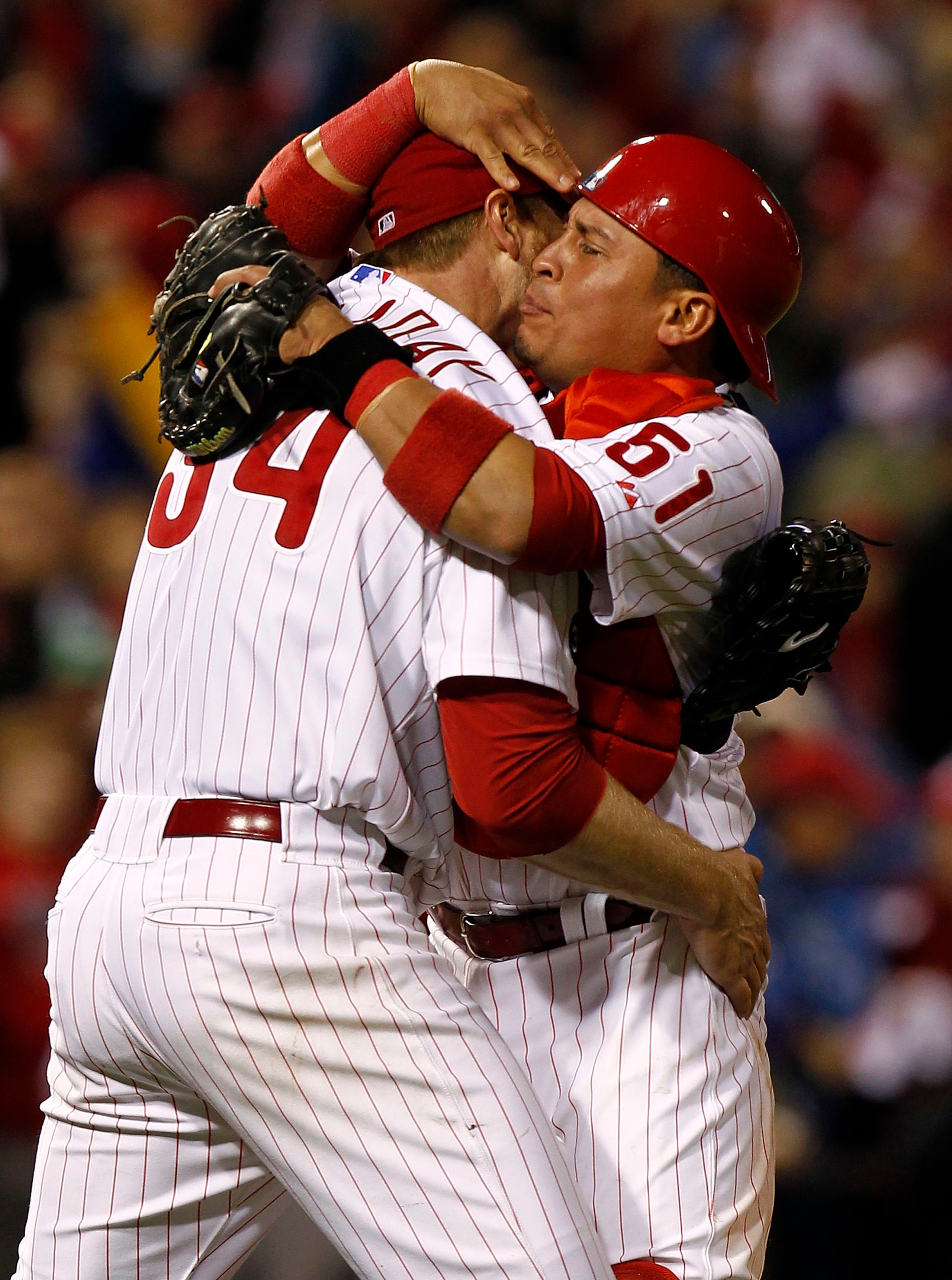 PHILADELPHIA - OCTOBER 06:  Roy Halladay #34 and Carlos Ruiz #51 of the Philadelphia Phillies celebrate Halladay's no-hitter and the win in Game 1 of the NLDS against the Cincinnati Reds at Citizens Bank Park on October 6, 2010 in Philadelphia, Pennsylvan