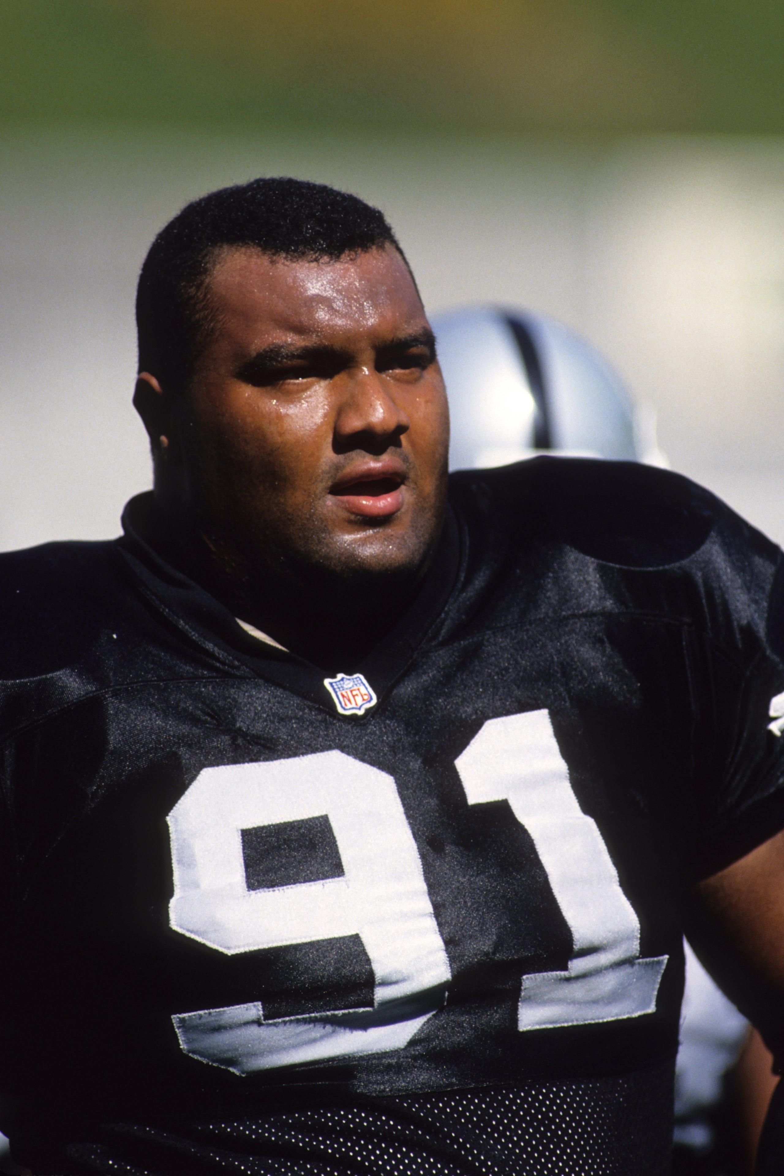 OAKLAND, CA - OCTOBER 22:  Defensive tackle Chester McGlockton #91 of the Oakland Raiders looks on during the game aganst the Indianapolis Colts at the Oakland/Alameda County Coliseum on October 22, 1995 in Oakland, California.  The Raiders won 30-17.  (P